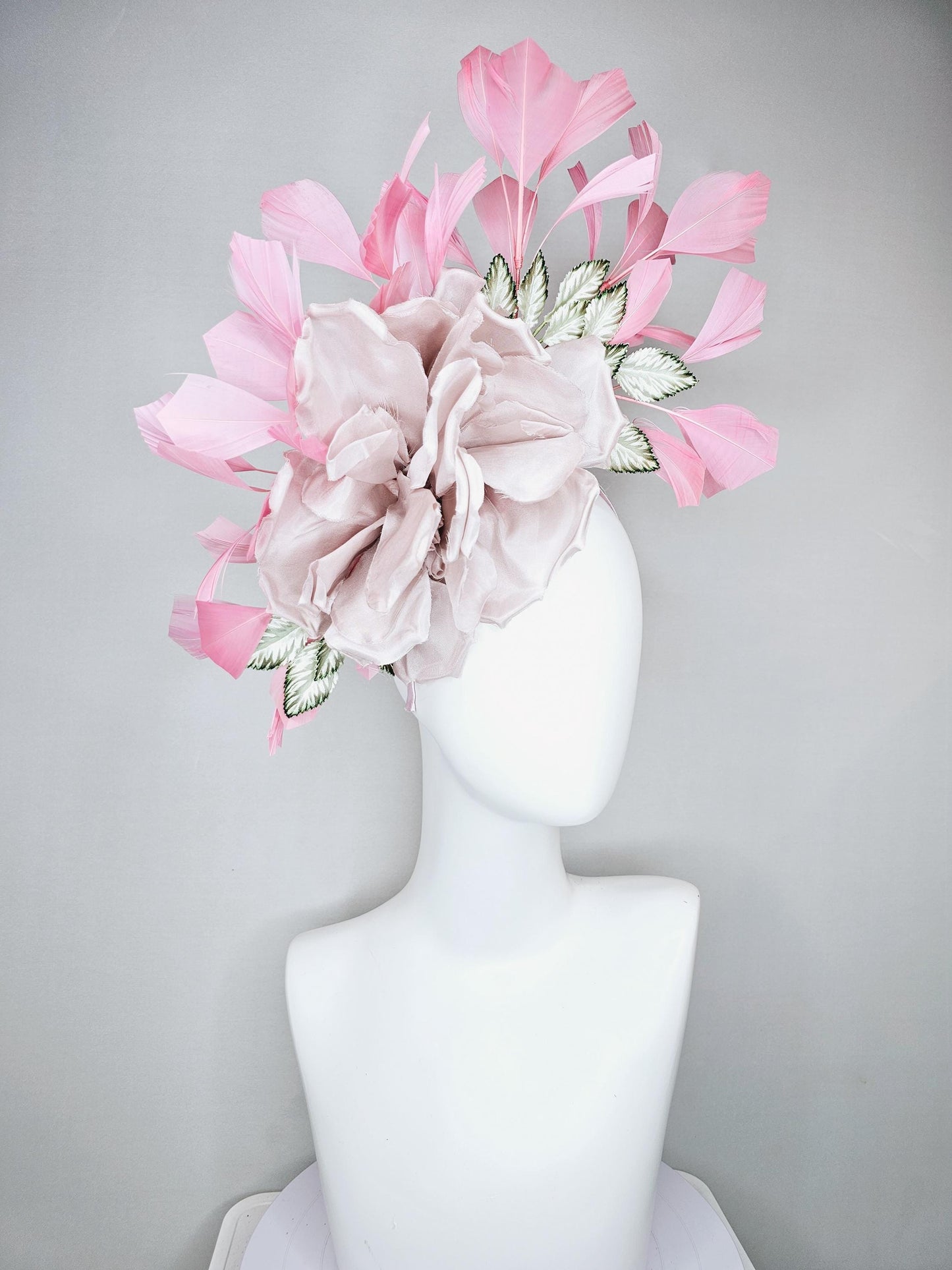 kentucky derby hat fascinator light dusty pink rose satin silk flower, white and green satin leaves and light baby pink branching feathers