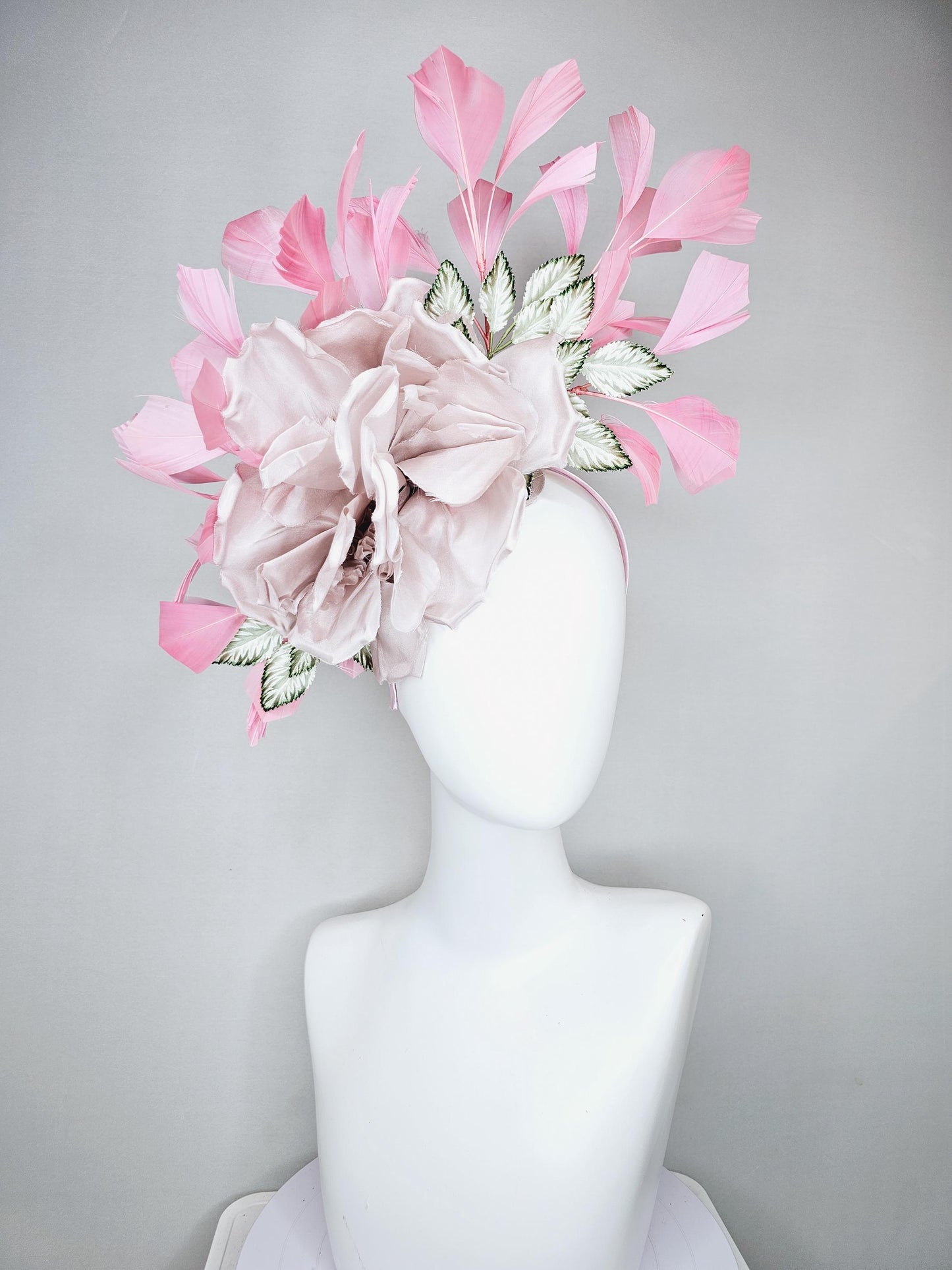 kentucky derby hat fascinator light dusty pink rose satin silk flower, white and green satin leaves and light baby pink branching feathers