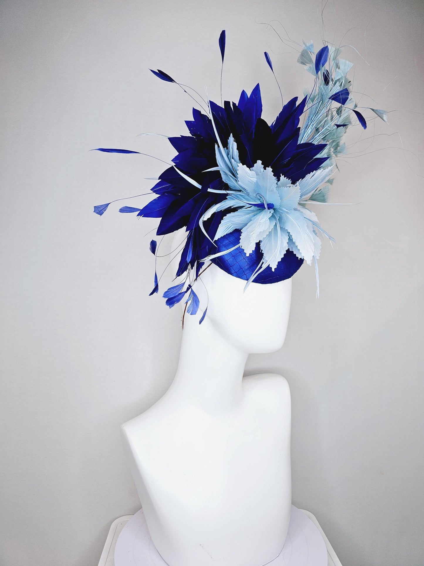 kentucky derby hat fascinator royal blue satin with netting, aqua turquoise navy blue feather flower, light teal blue branching feathers