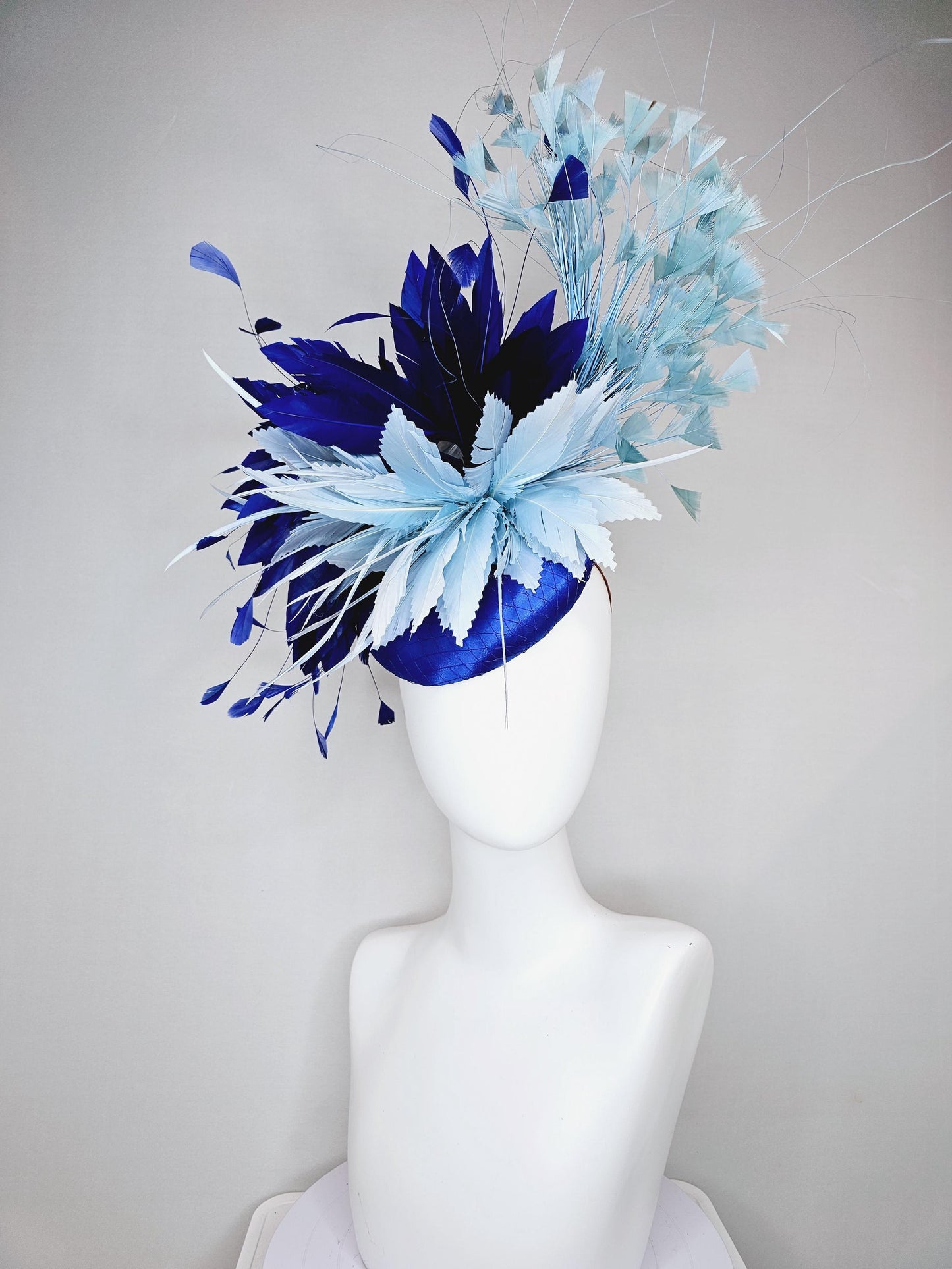 kentucky derby hat fascinator royal blue satin with netting, aqua turquoise navy blue feather flower, light teal blue branching feathers