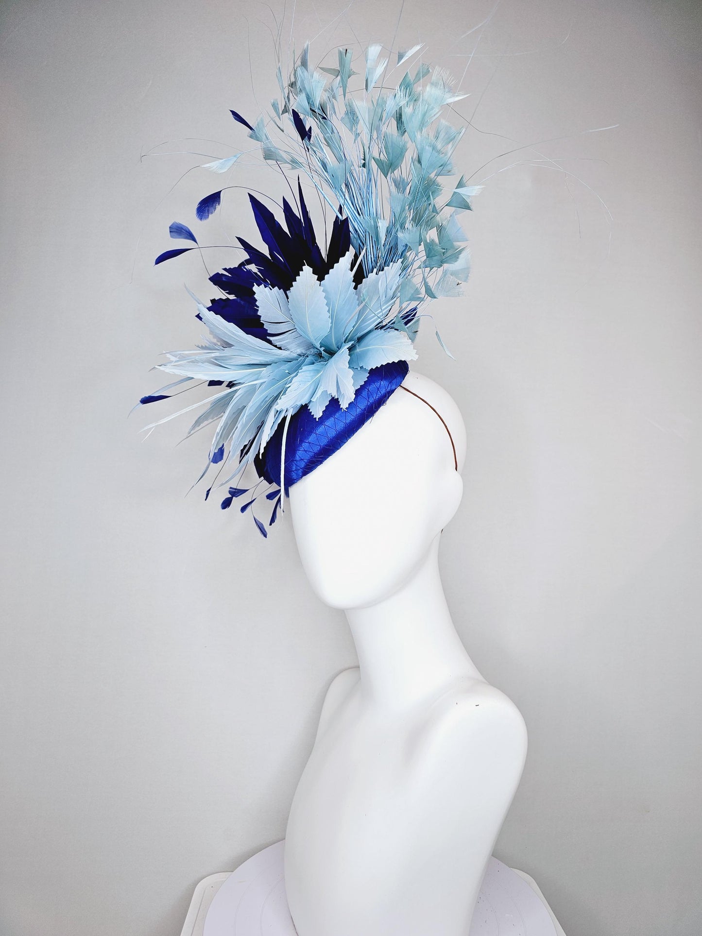 kentucky derby hat fascinator royal blue satin with netting, aqua turquoise navy blue feather flower, light teal blue branching feathers