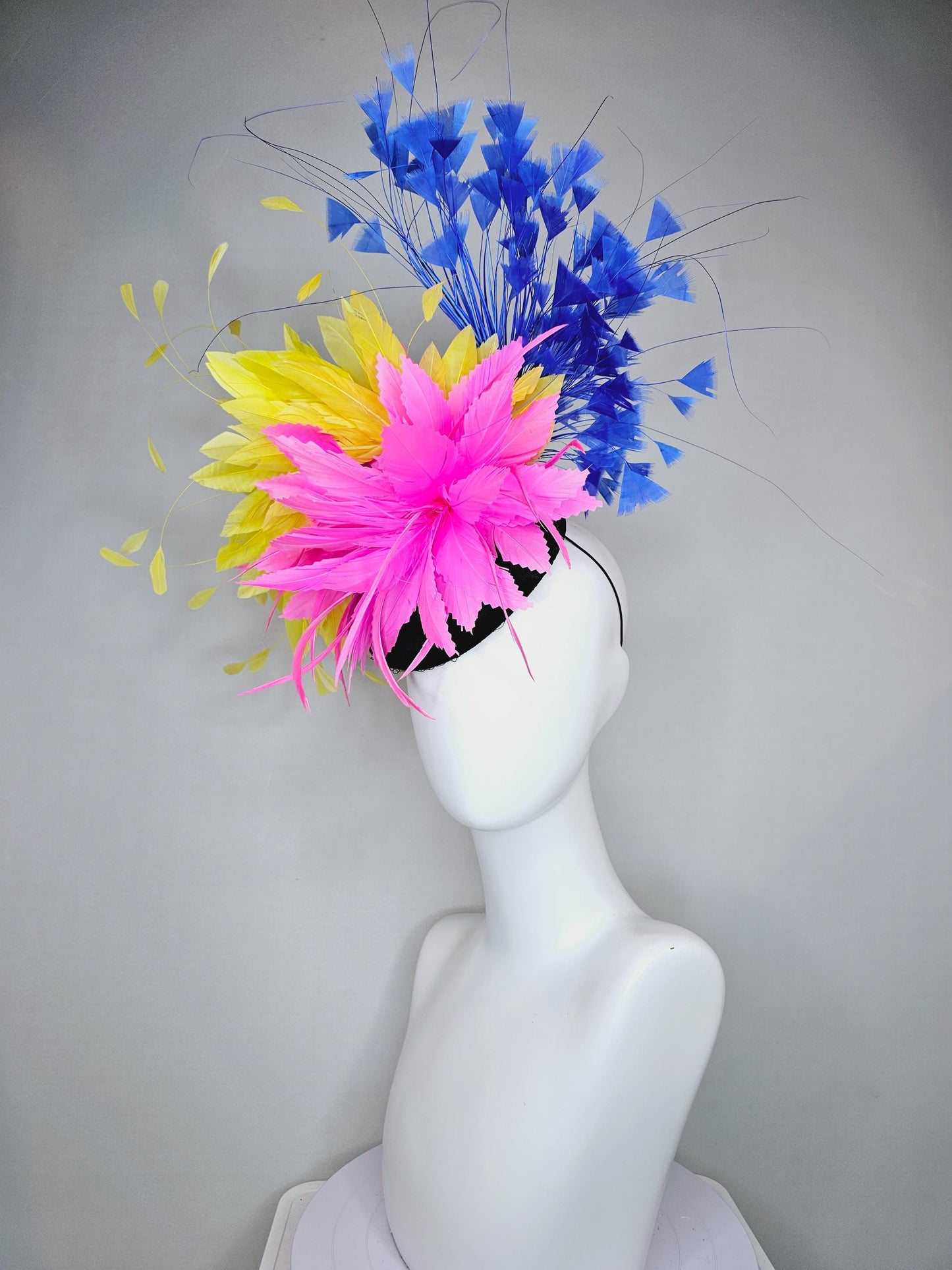 kentucky derby hat fascinator black satin with netting, pink and yellow feather flower, cobalt royal blue branching feathers