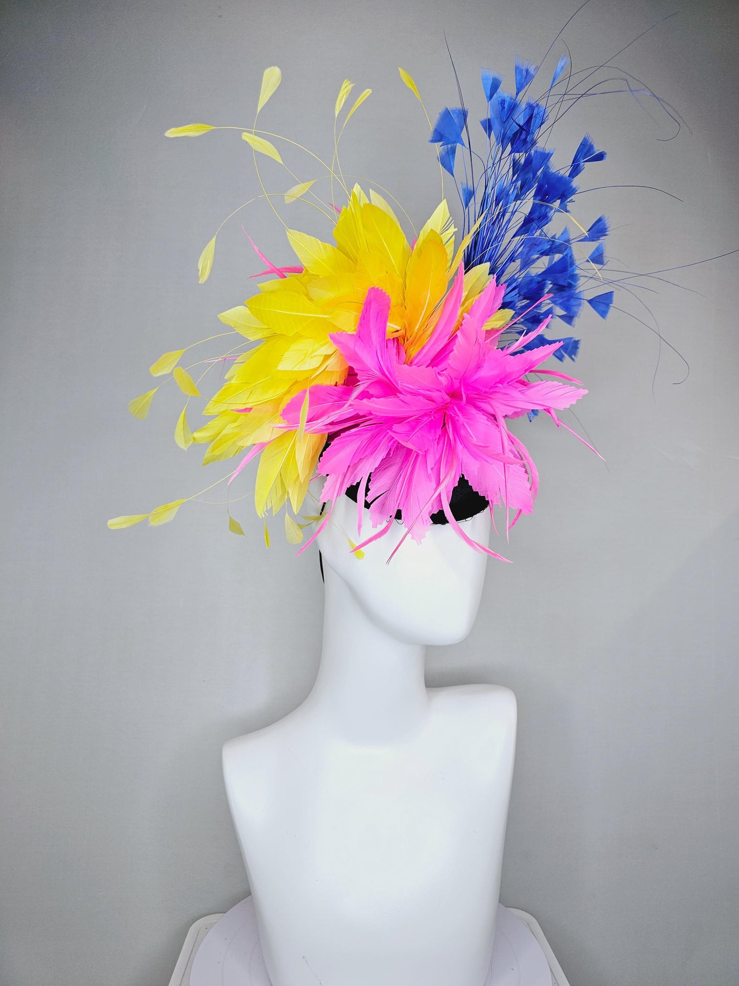 kentucky derby hat fascinator black satin with netting, pink and yellow feather flower, cobalt royal blue branching feathers