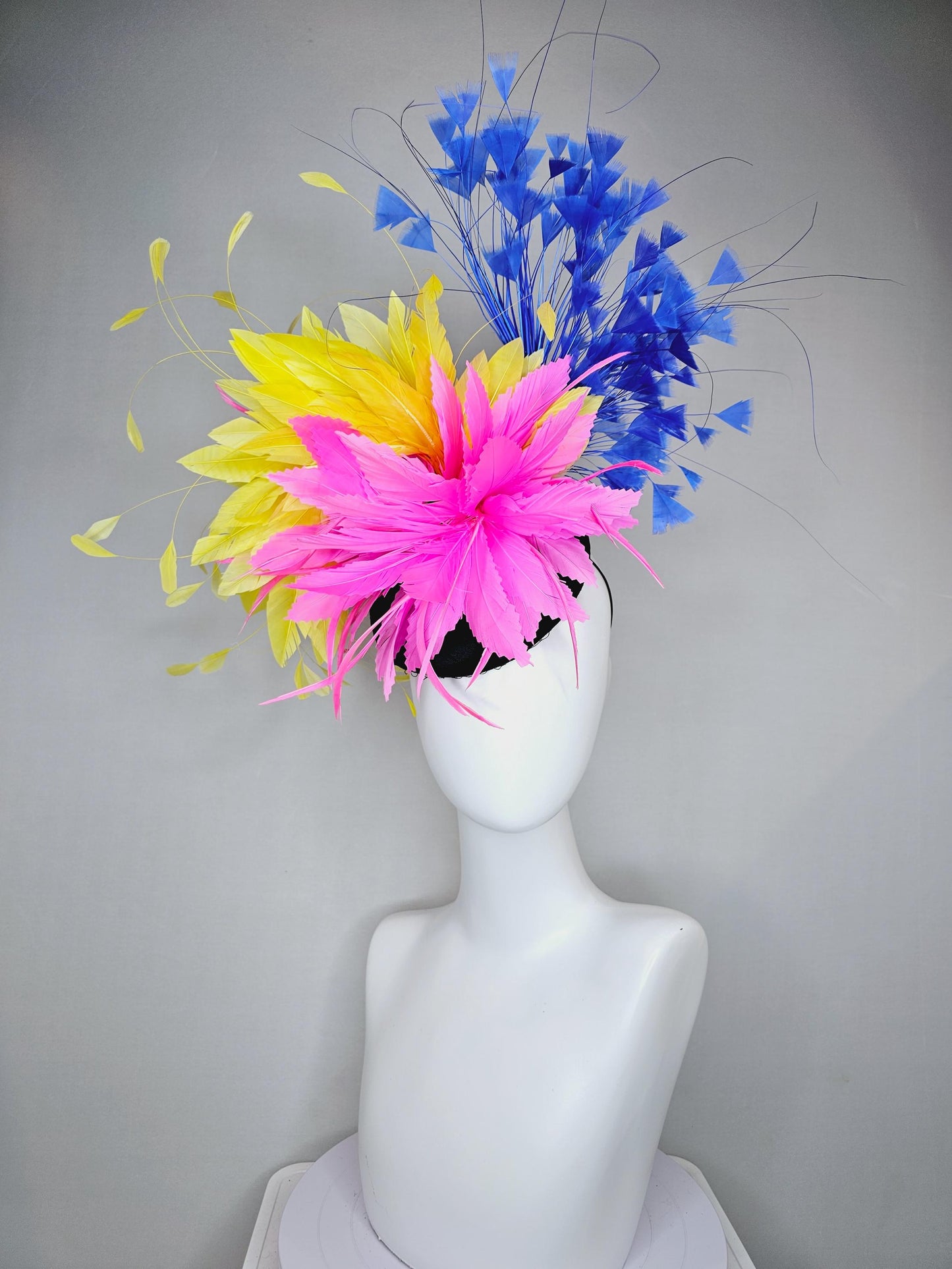 kentucky derby hat fascinator black satin with netting, pink and yellow feather flower, cobalt royal blue branching feathers