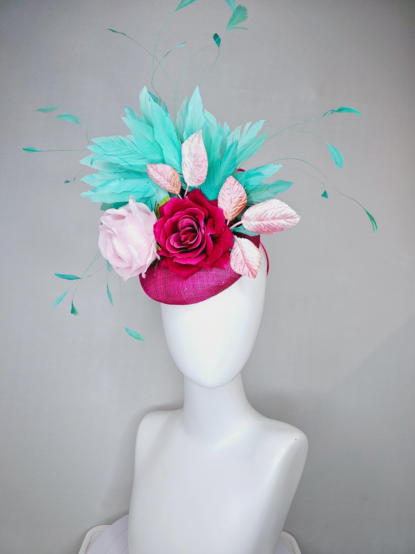 kentucky derby hat fascinator pink sinamay with light pink fuchsia satin silk rose flowers and baby pink leaves,aqua blue branching feathers