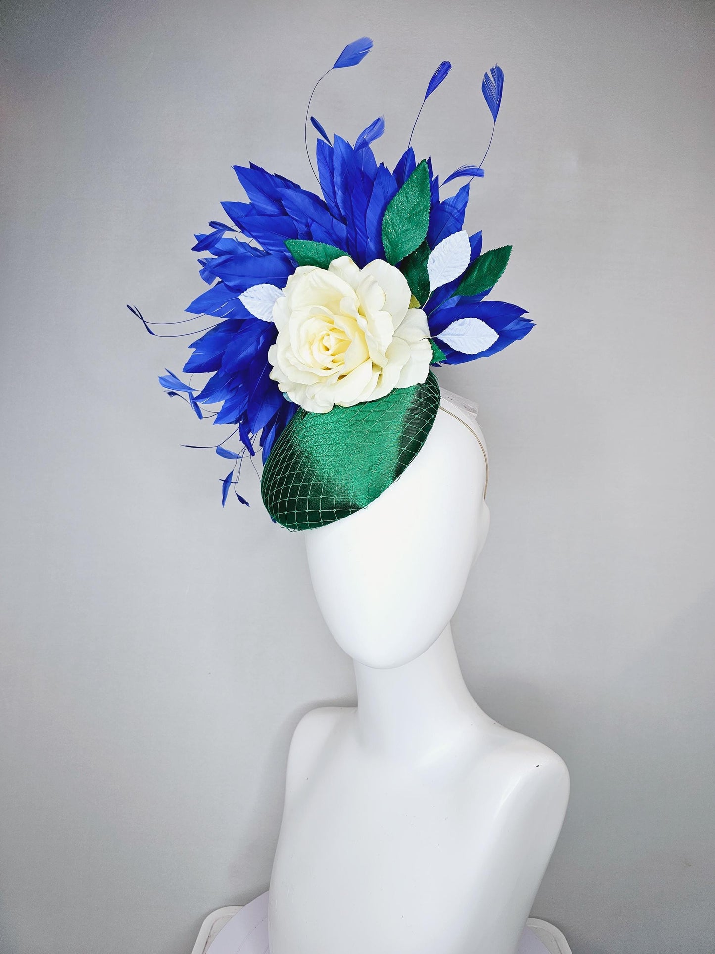 kentucky derby hat fascinator green satin with netting,white ivory satin rose flower,green leaves,royal cobalt blue branching feathers