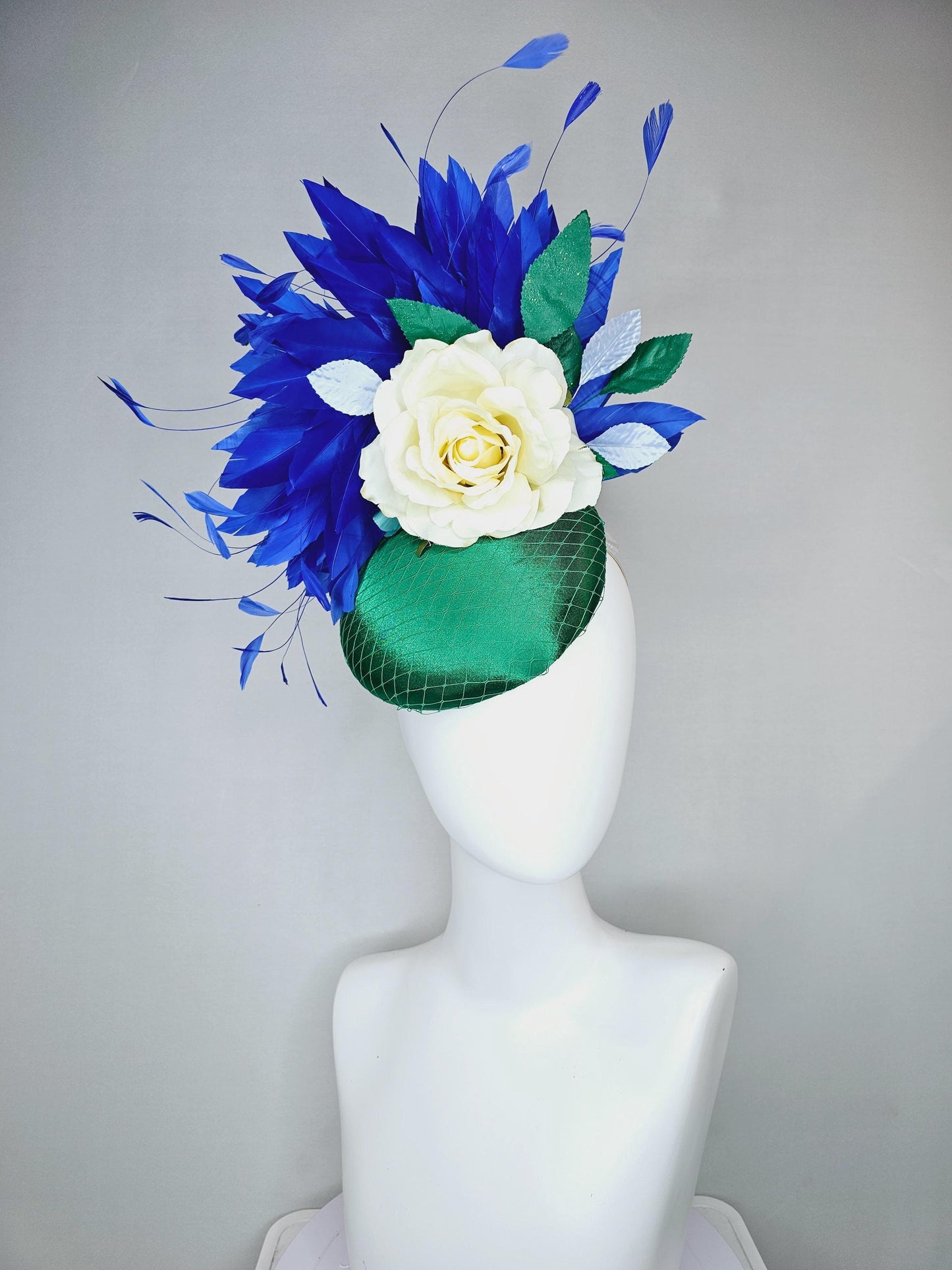 kentucky derby hat fascinator green satin with netting,white ivory satin rose flower,green leaves,royal cobalt blue branching feathers