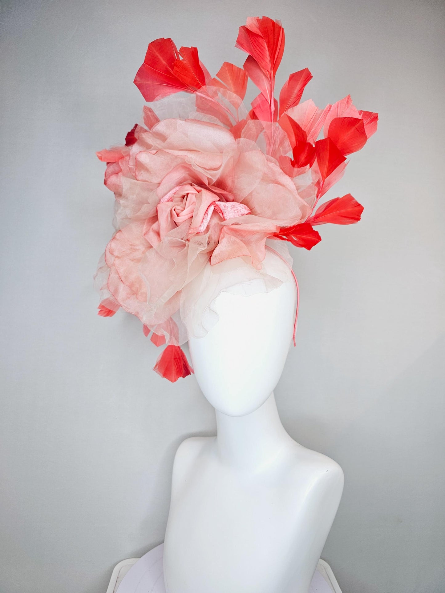 kentucky derby hat fascinator with large ombre peach pink organza flower and coral orange feathers, thin headband