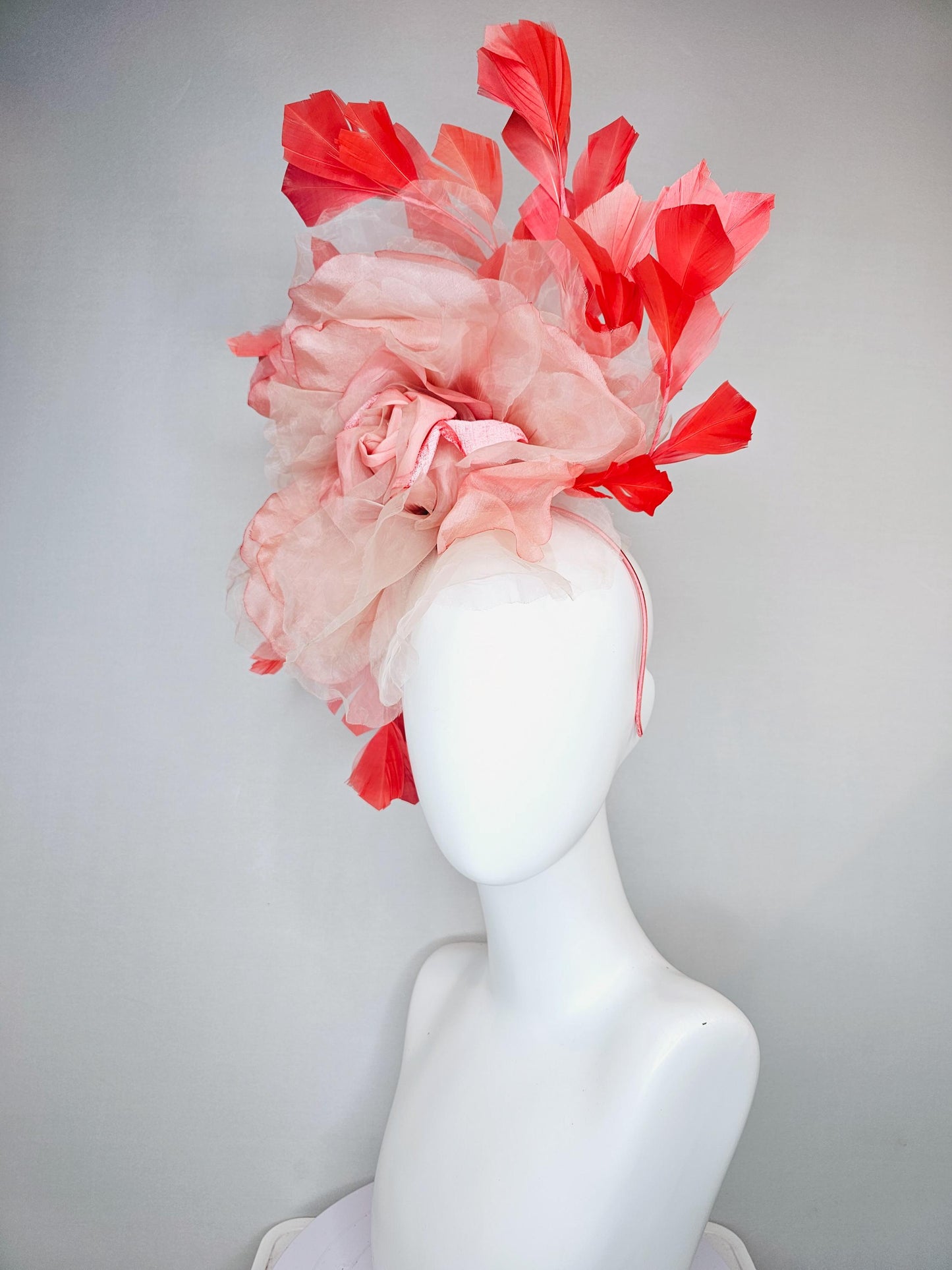 kentucky derby hat fascinator with large ombre peach pink organza flower and coral orange feathers, thin headband