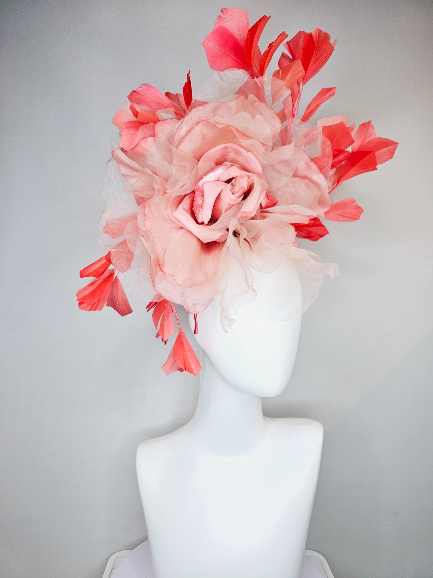 kentucky derby hat fascinator with large ombre peach pink organza flower and coral orange feathers, thin headband