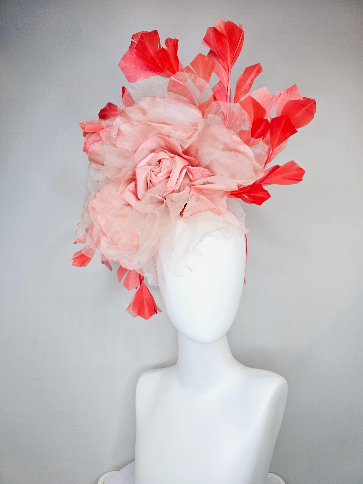 kentucky derby hat fascinator with large ombre peach pink organza flower and coral orange feathers, thin headband