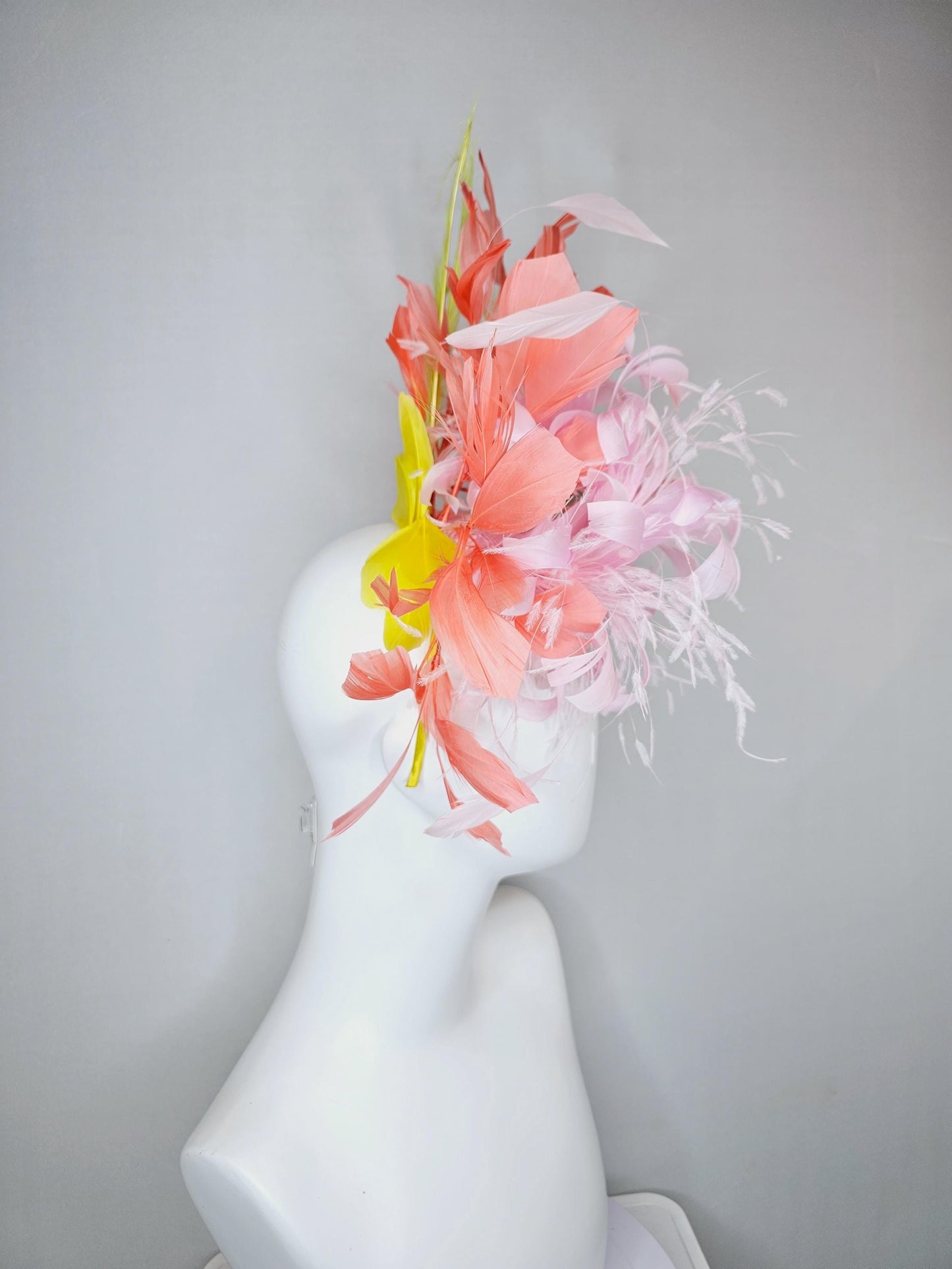 kentucky derby hat fascinator light pink fluffy feather flowers with coral orange feathers, yellow feathers, thin headband