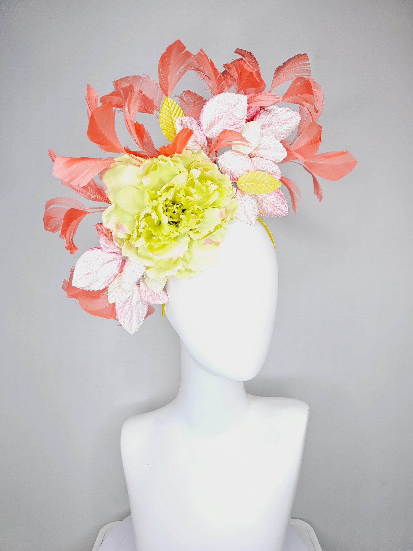 kentucky derby hat fascinator with yellow satin silk flower and light blush pink leaves, orange coral feathers on thin headband