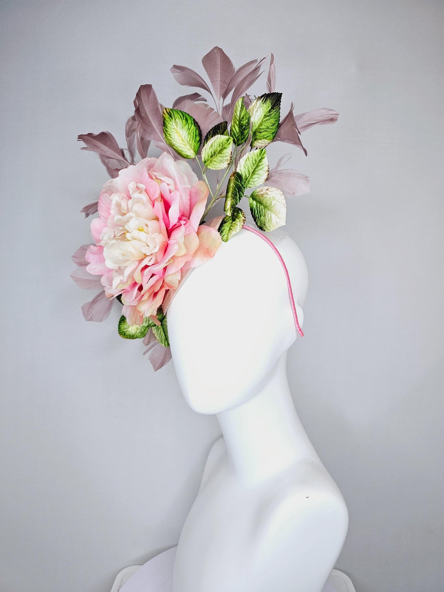 kentucky derby hat fascinator with large blush pink ombre satin silk flower with green ombre leaves and taupe feathers, thin headband