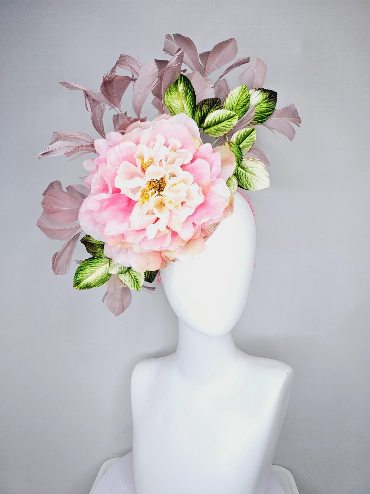 kentucky derby hat fascinator with large blush pink ombre satin silk flower with green ombre leaves and taupe feathers, thin headband