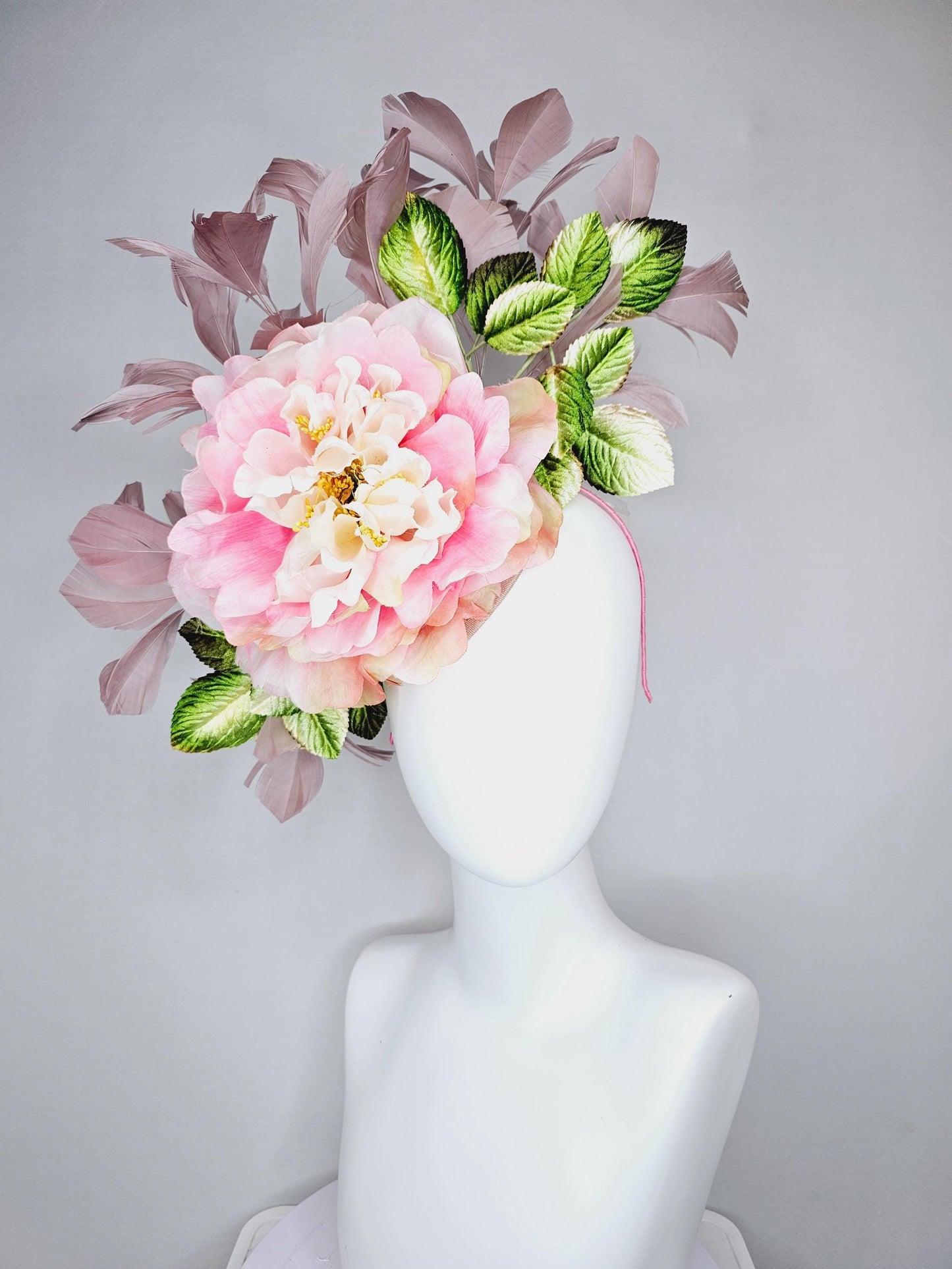 kentucky derby hat fascinator with large blush pink ombre satin silk flower with green ombre leaves and taupe feathers, thin headband