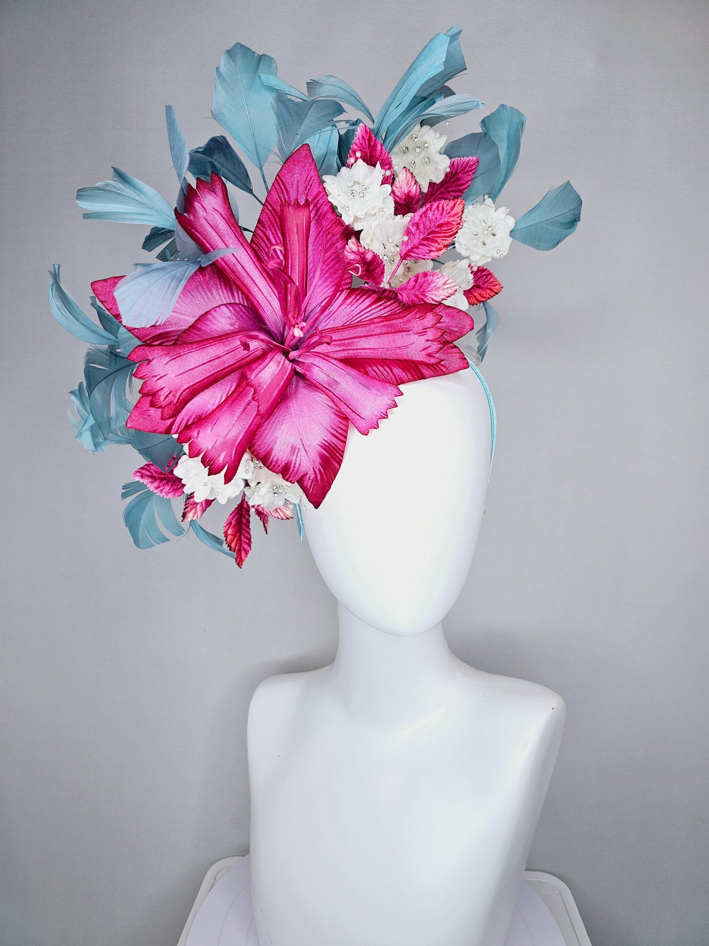 kentucky derby hat fascinator black sinamay,pink fuchsia satin flower,small white flowers with crystal pearl,pink leaves,teal blue feathers