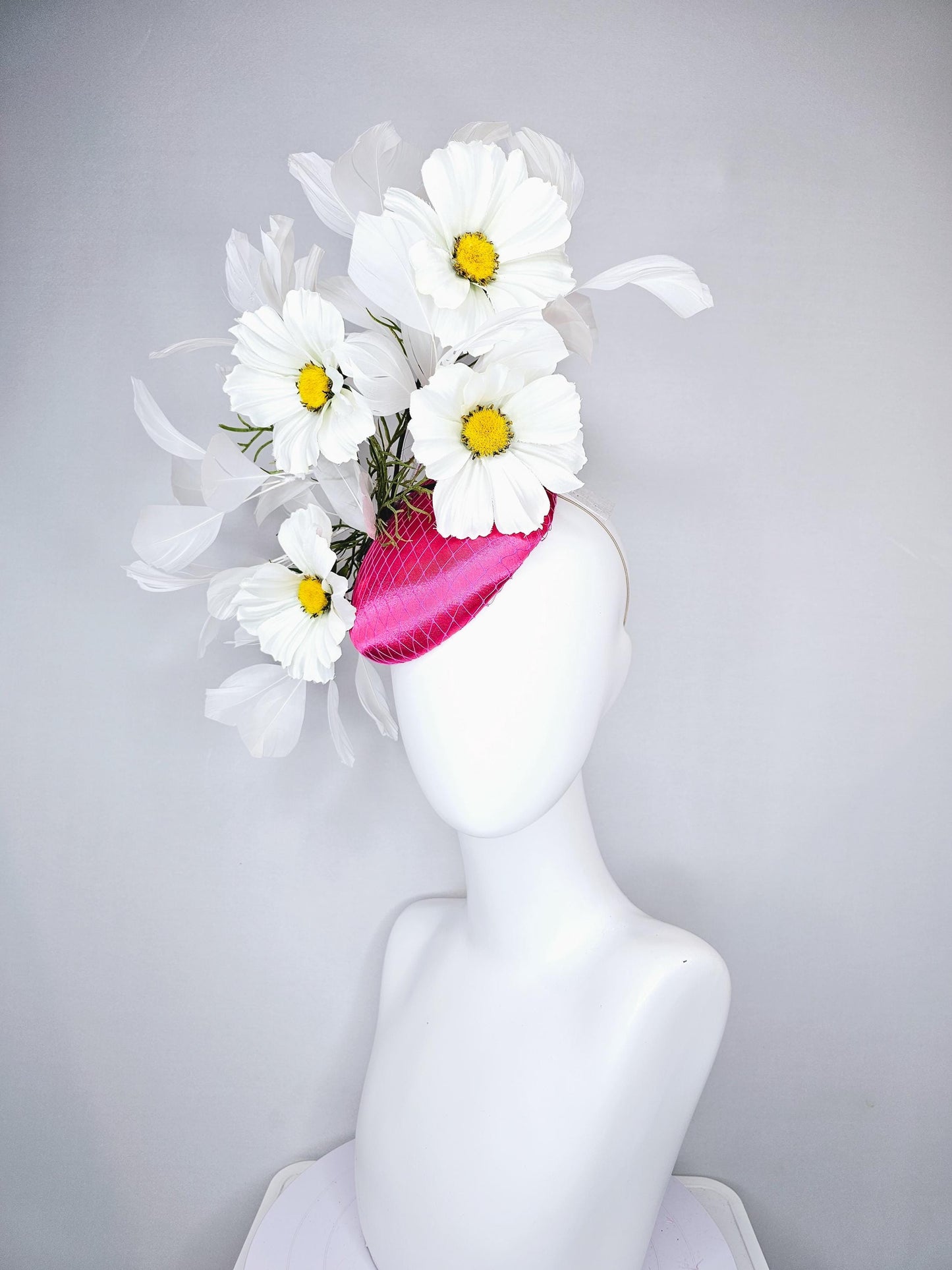 kentucky derby hat fascinator pink fuchsia satin with netting, white satin flowers with yellow center, green stems, white ivory feathers