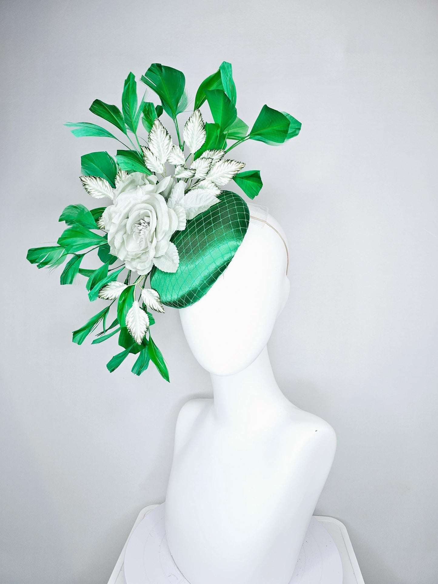 kentucky derby hat fascinator with emerald green satin with netting and mint light green satin silk rose flowers, green branching feathers