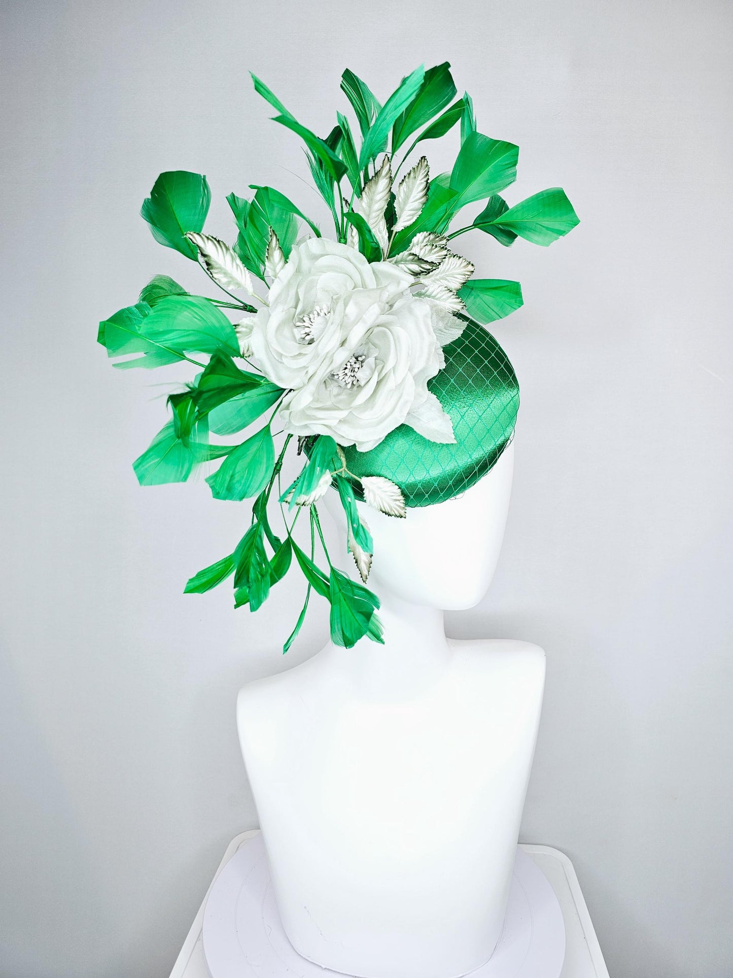 kentucky derby hat fascinator with emerald green satin with netting and mint light green satin silk rose flowers, green branching feathers