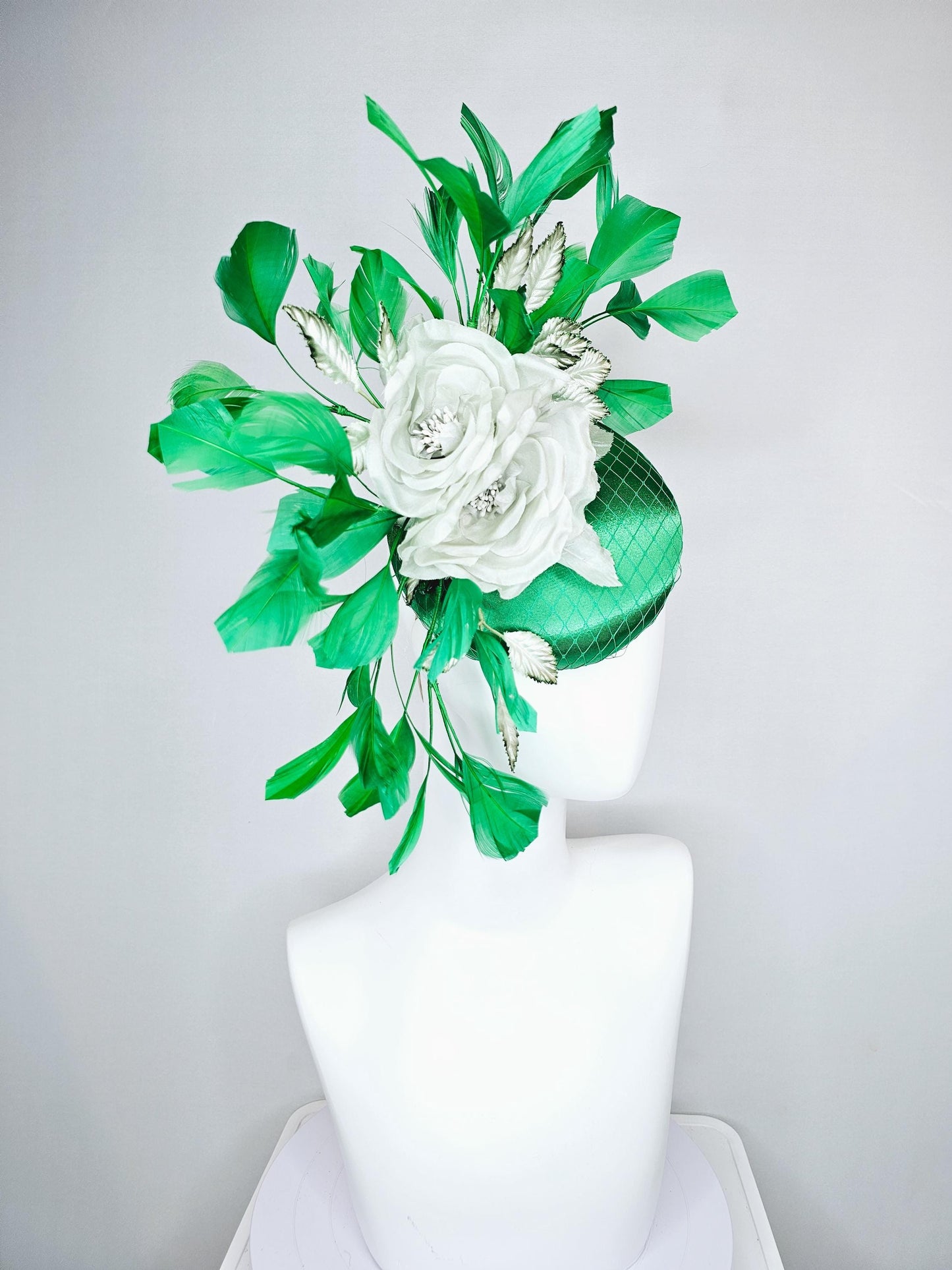 kentucky derby hat fascinator with emerald green satin with netting and mint light green satin silk rose flowers, green branching feathers