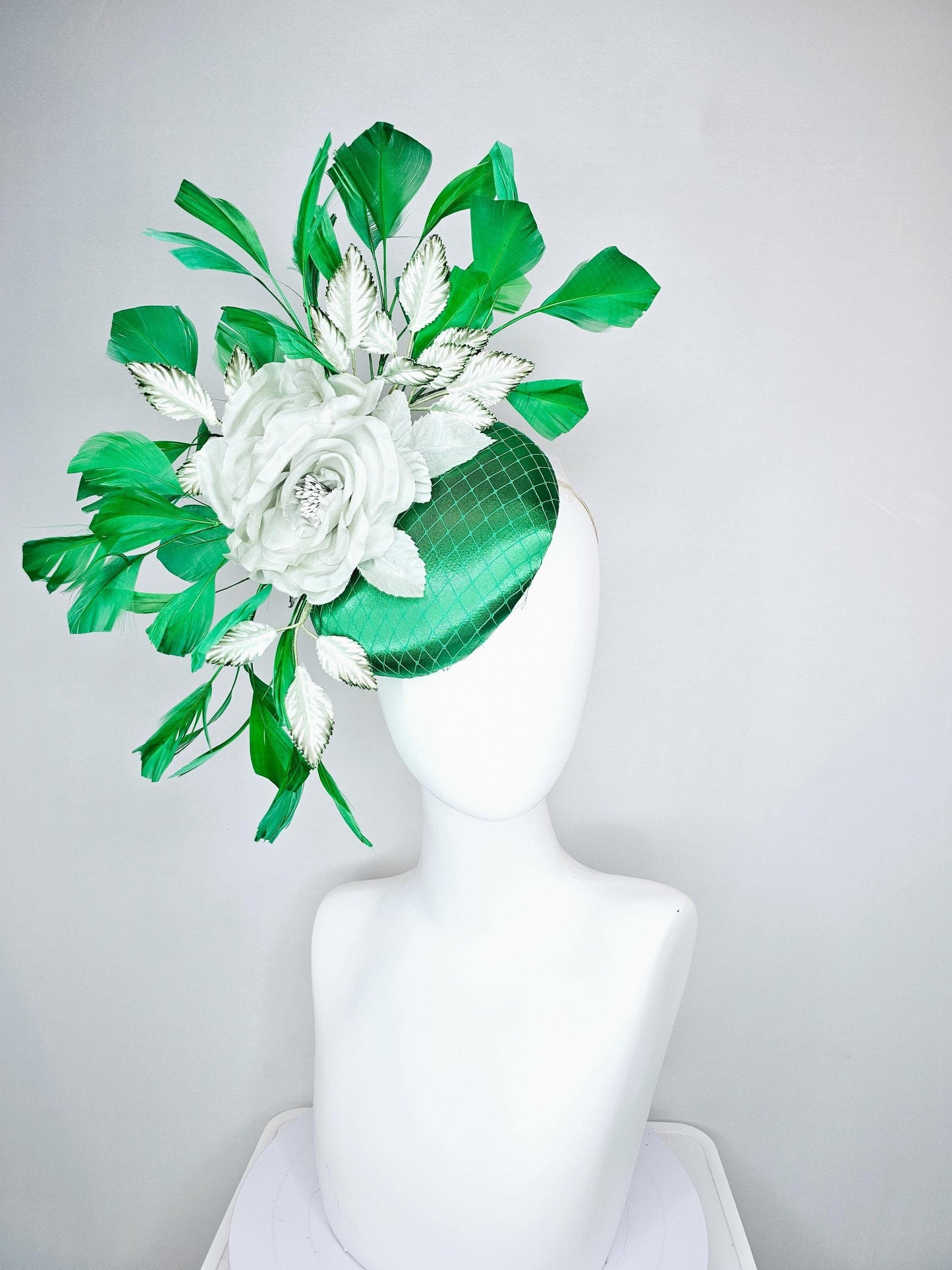 kentucky derby hat fascinator with emerald green satin with netting and mint light green satin silk rose flowers, green branching feathers