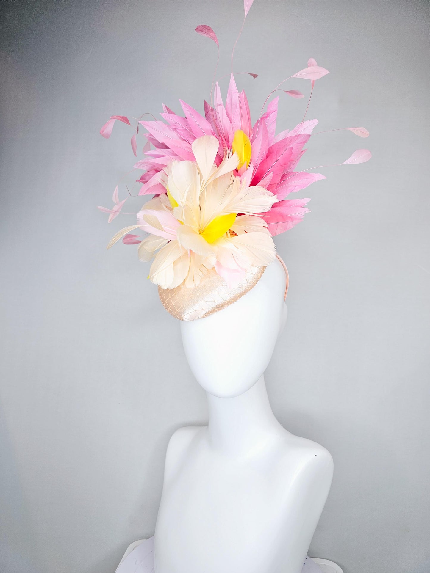 kentucky derby hat fascinator champagne satin with netting,cream neutral and yellow feathers,with light pink branching feathers