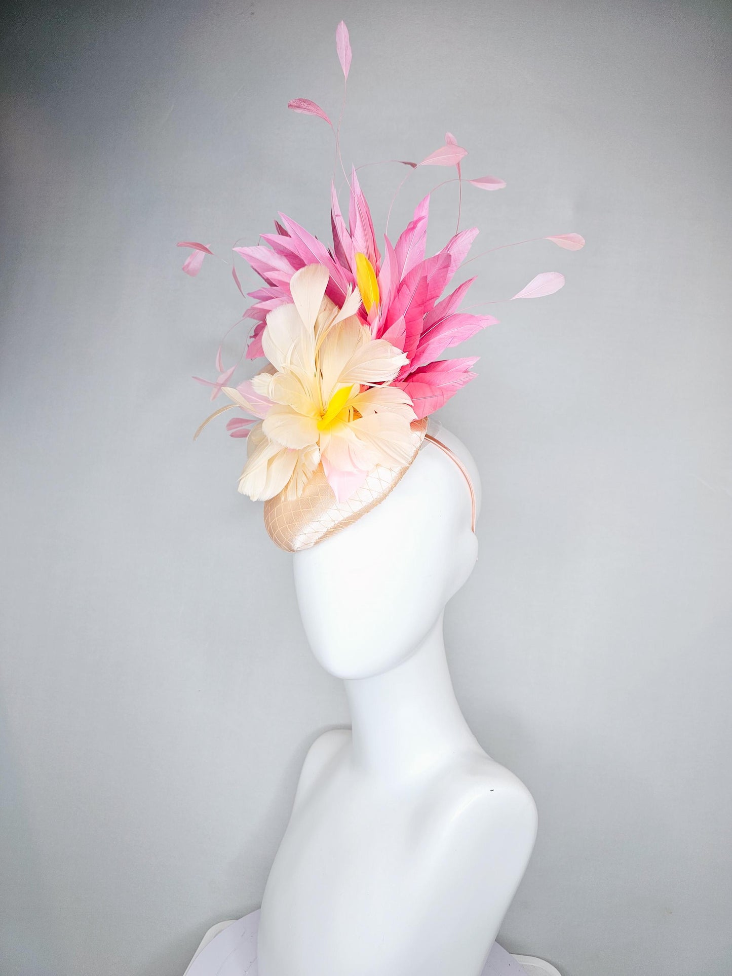 kentucky derby hat fascinator champagne satin with netting,cream neutral and yellow feathers,with light pink branching feathers