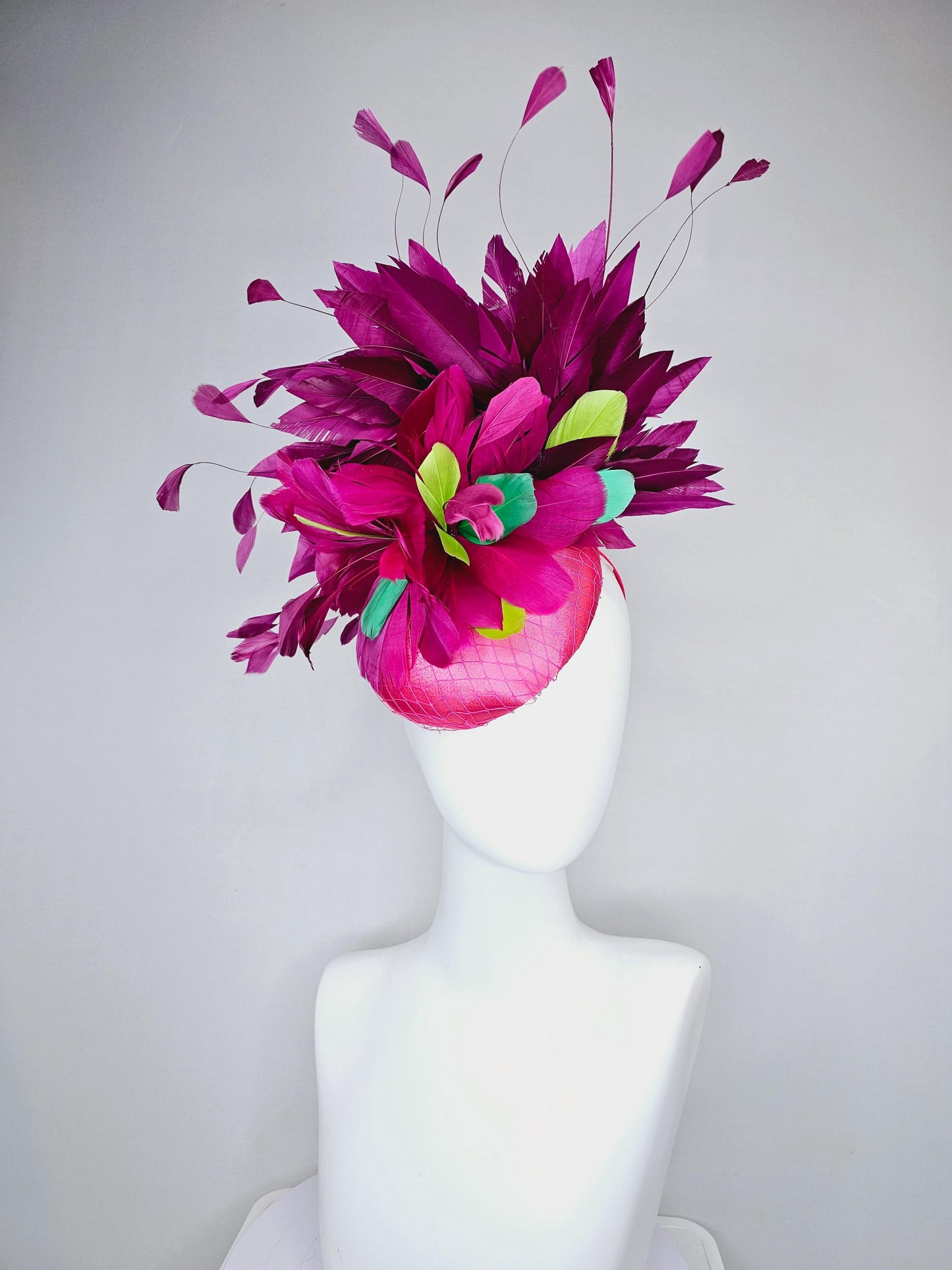 kentucky derby hat fascinator hot pink satin with netting,magenta purple branching feathers and lime green,blue green aqua,pink feathers