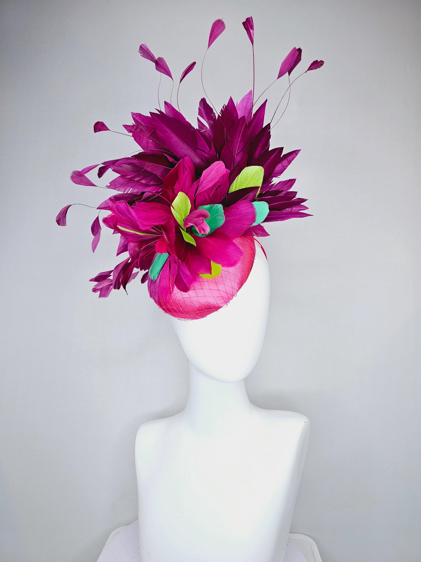 kentucky derby hat fascinator hot pink satin with netting,magenta purple branching feathers and lime green,blue green aqua,pink feathers