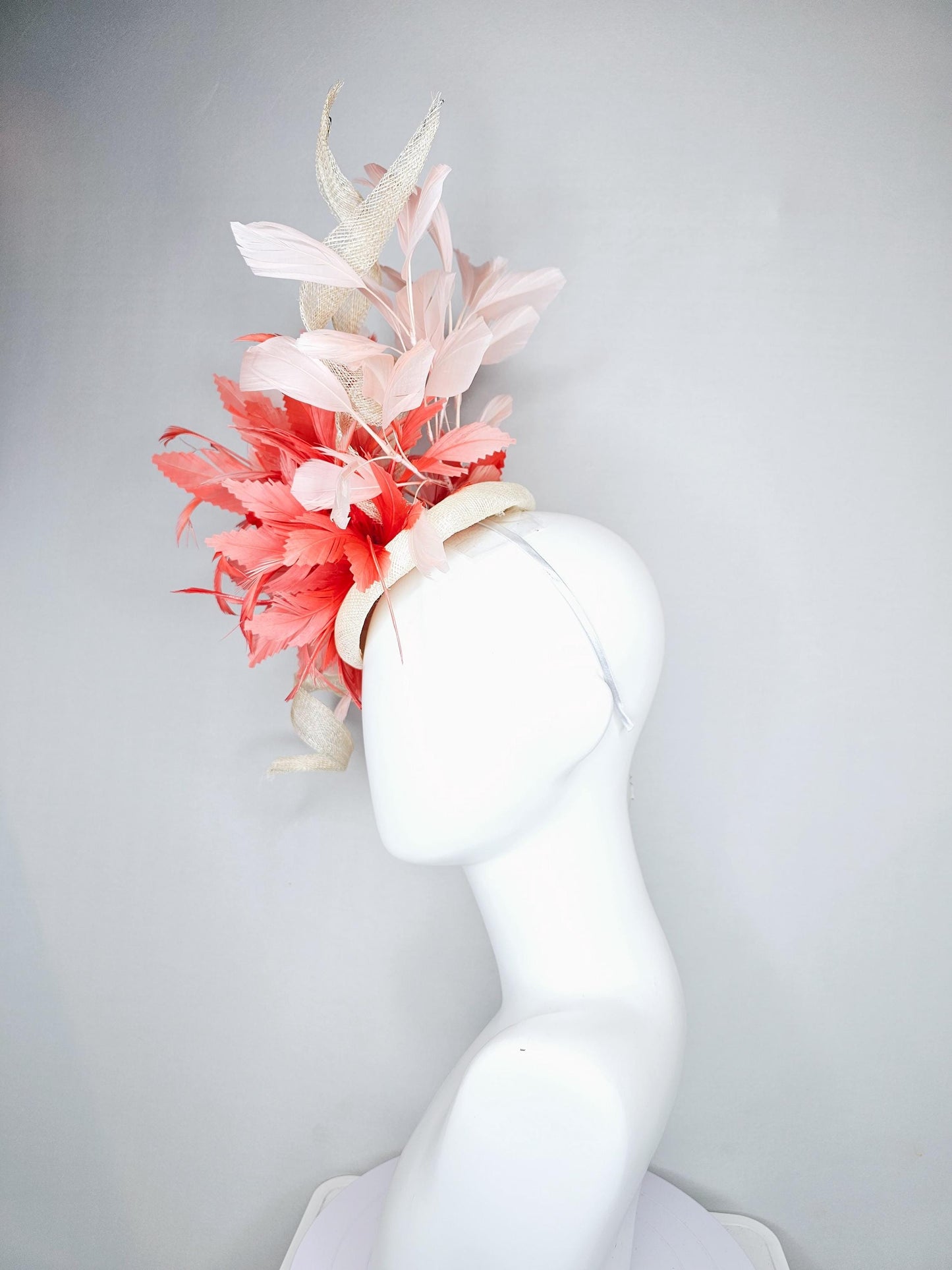 kentucky derby hat fascinator ivory white sinamay with curls,and coral feather flower with light pink branching feathers