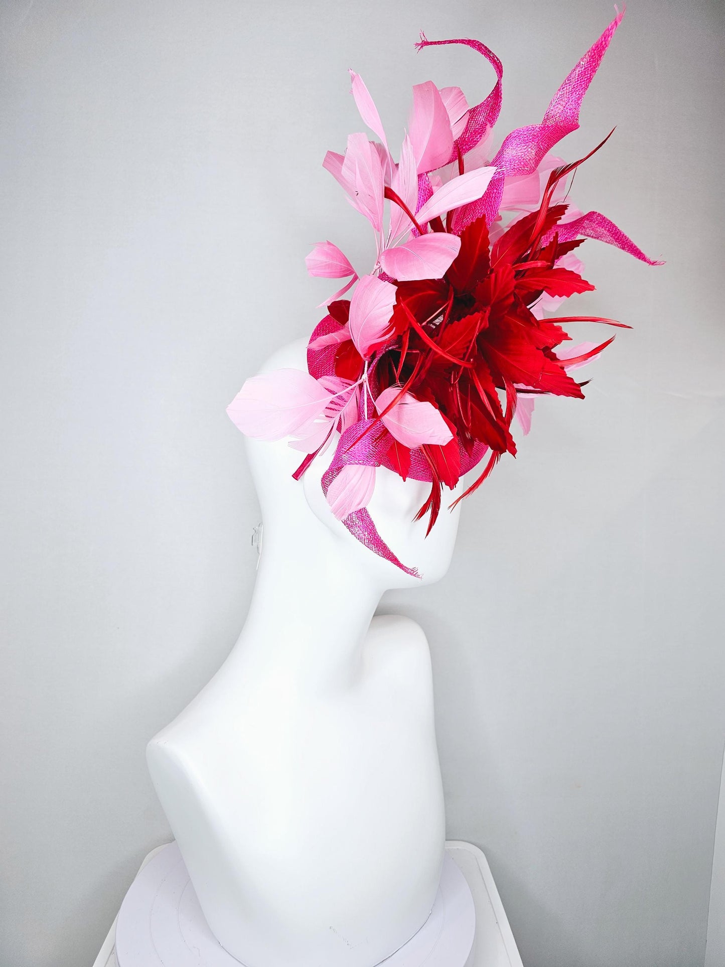 kentucky derby hat fascinator pink sinamay with large curls,bright red feathers and light pink branching feathers