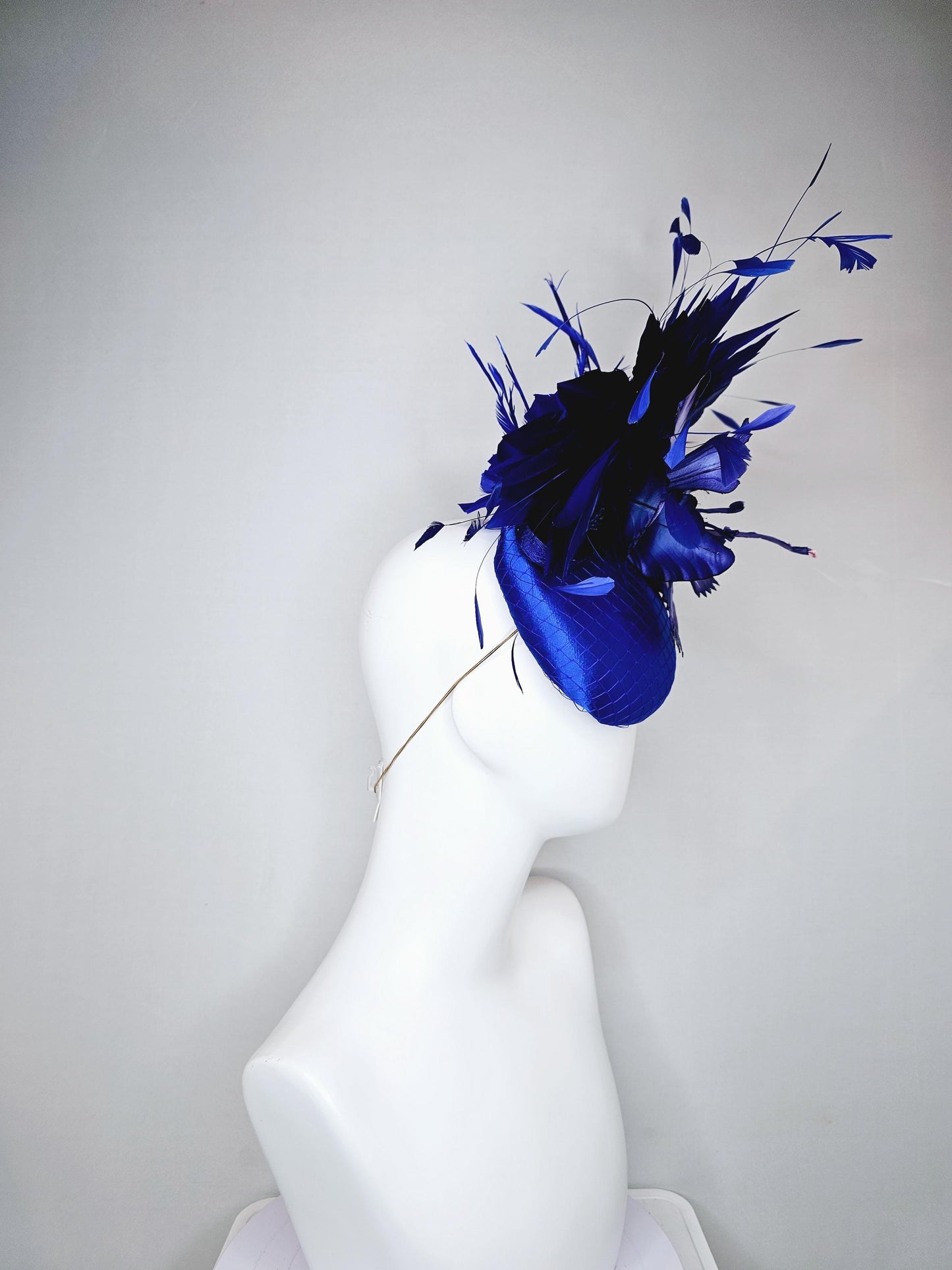 kentucky derby hat fascinator royal blue satin with netting,large ombre light blue satin flower, and midnight navy blue branching feathers