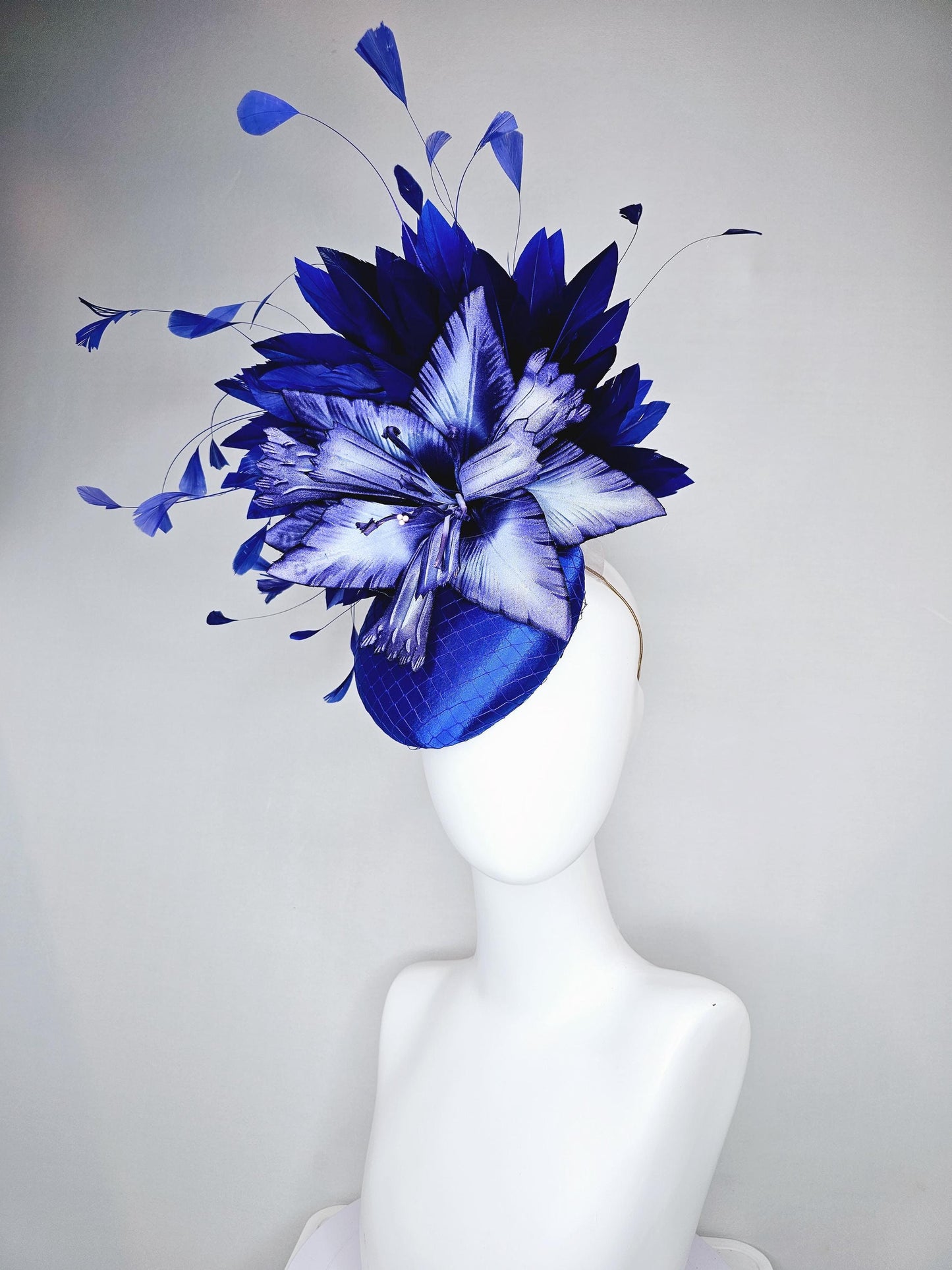 kentucky derby hat fascinator royal blue satin with netting,large ombre light blue satin flower, and midnight navy blue branching feathers