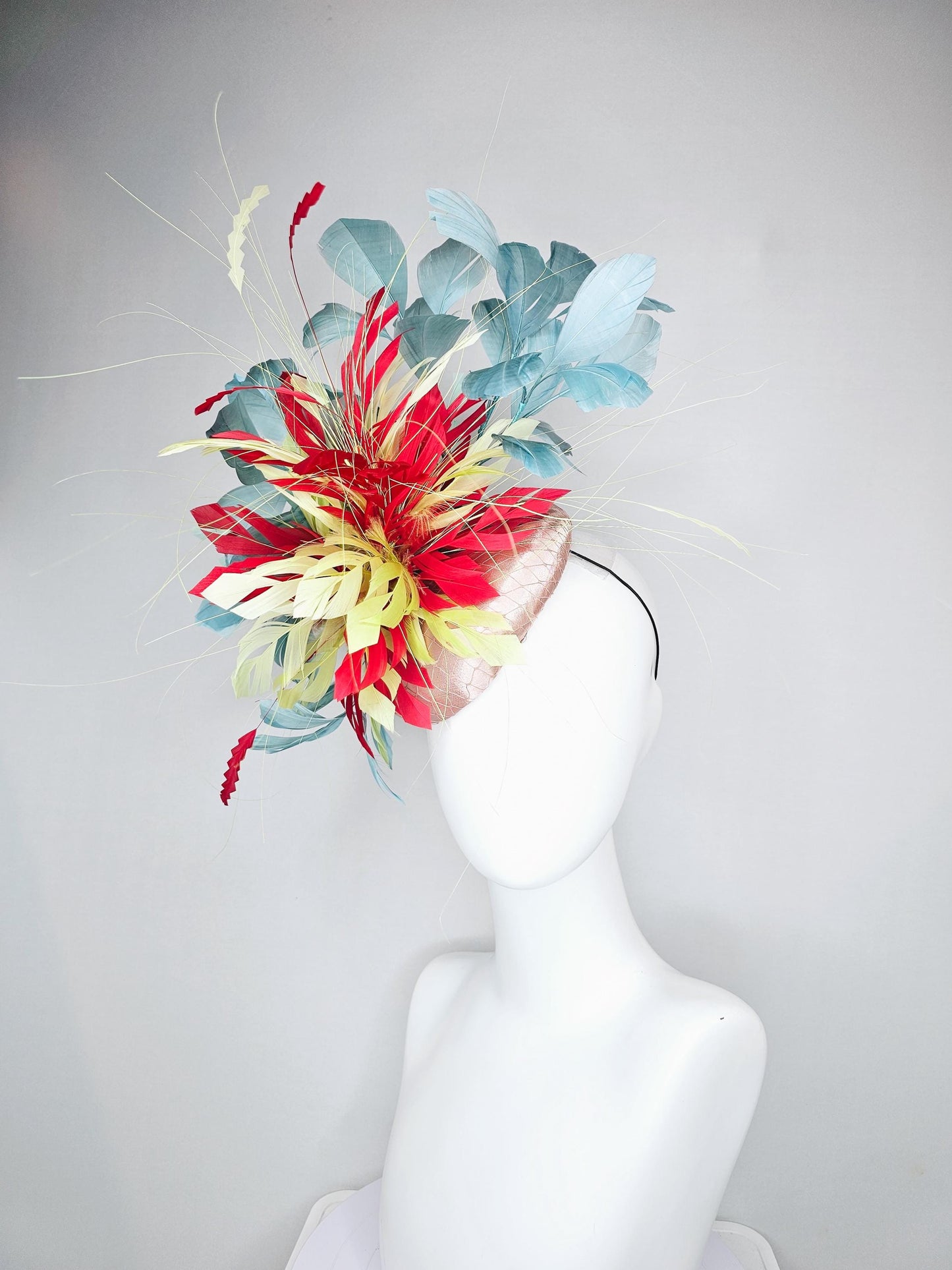 kentucky derby hat fascinator champagne satin with netting with colorful yellow, bright red, and teal blue branching feathers