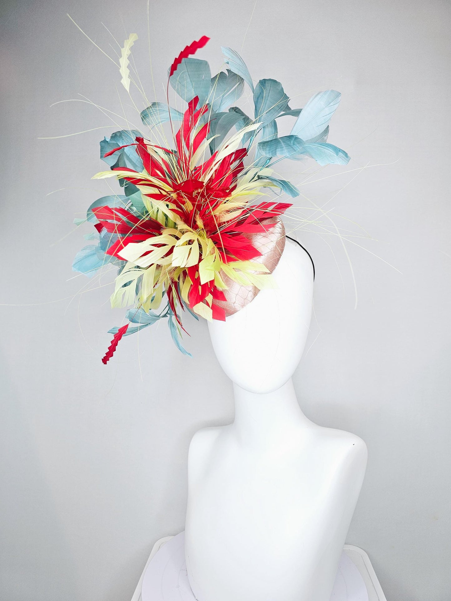 kentucky derby hat fascinator champagne satin with netting with colorful yellow, bright red, and teal blue branching feathers