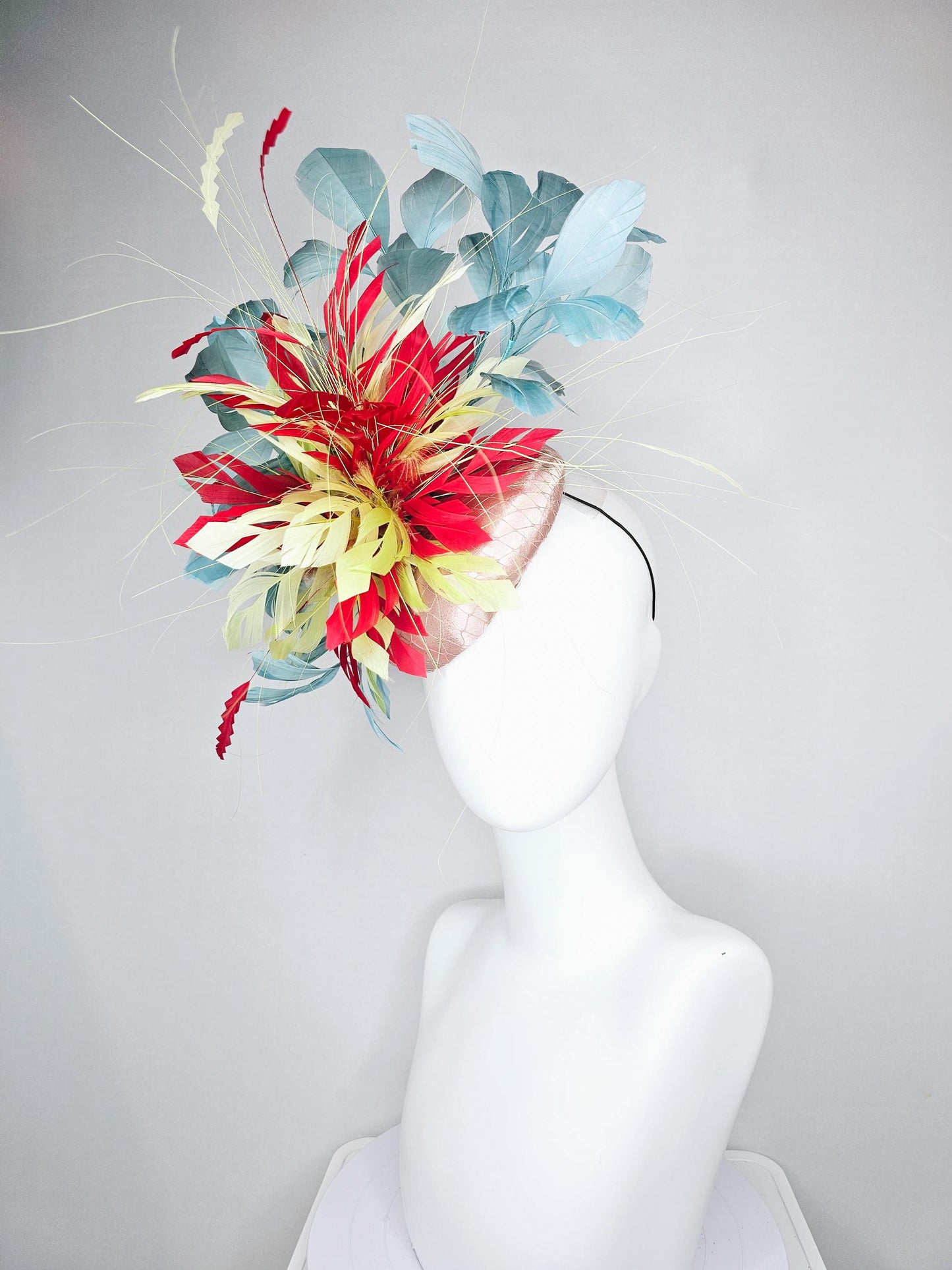 kentucky derby hat fascinator champagne satin with netting with colorful yellow, bright red, and teal blue branching feathers