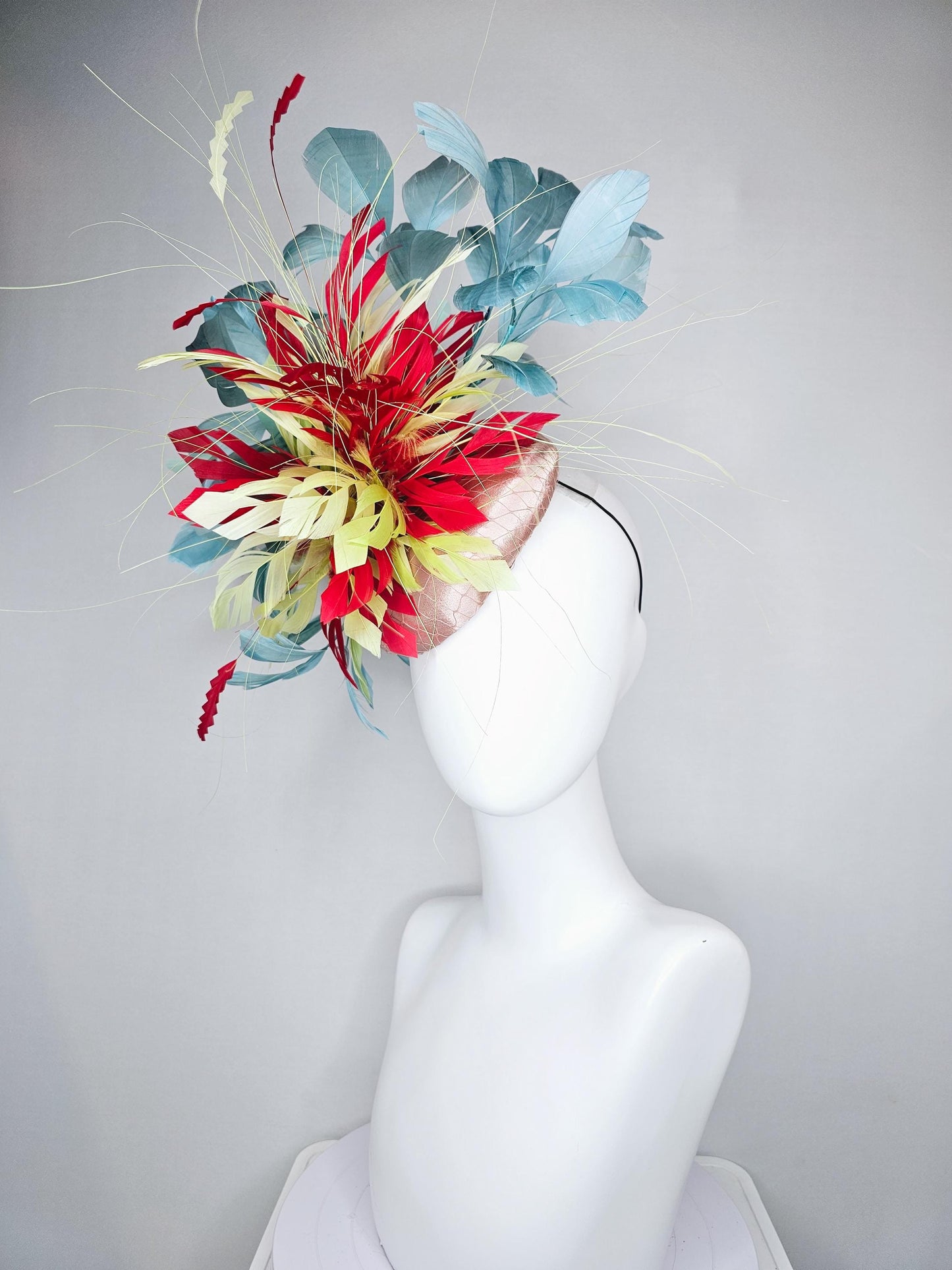 kentucky derby hat fascinator champagne satin with netting with colorful yellow, bright red, and teal blue branching feathers