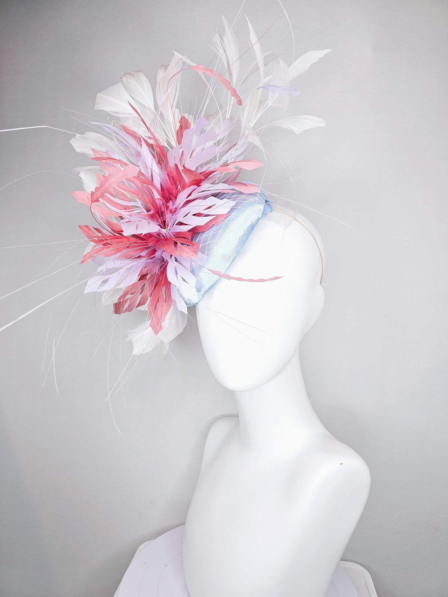 kentucky derby hat fascinator light baby blue satin with netting with blush pink,white,and light purple branching feathers