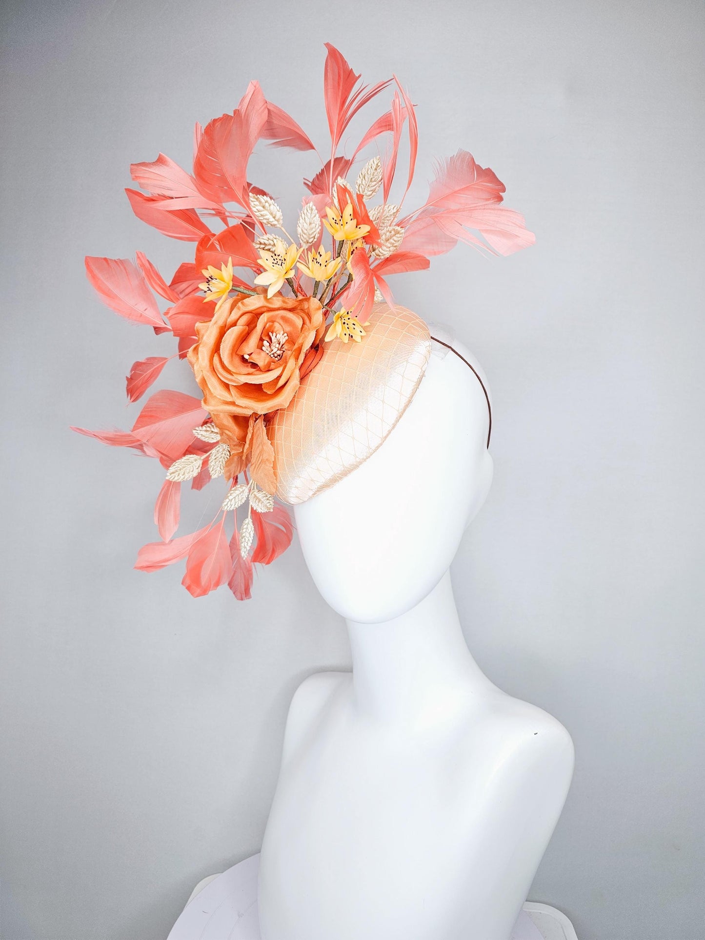 kentucky derby hat fascinator champagne satin with netting,orange satin flowers,yellow floral stems,coral orange feathers and gold leaves