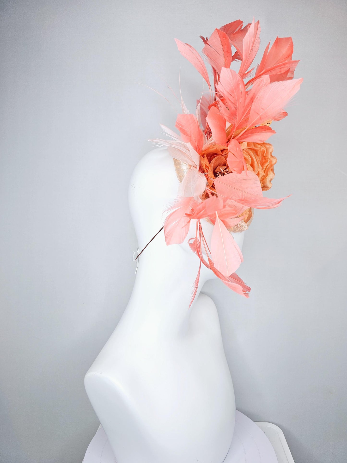 kentucky derby hat fascinator champagne satin with netting,orange satin flowers,yellow floral stems,coral orange feathers and gold leaves