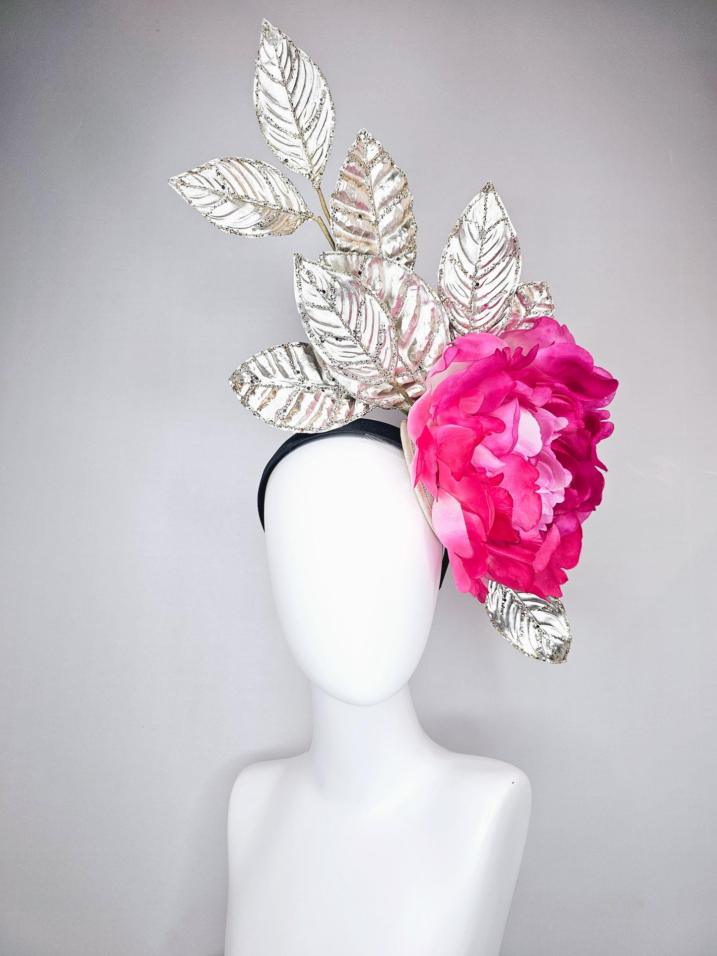 kentucky derby hat fascinator large ombre pink satin silk flower with gold sparkle glitter branching leaves on a black satin headband