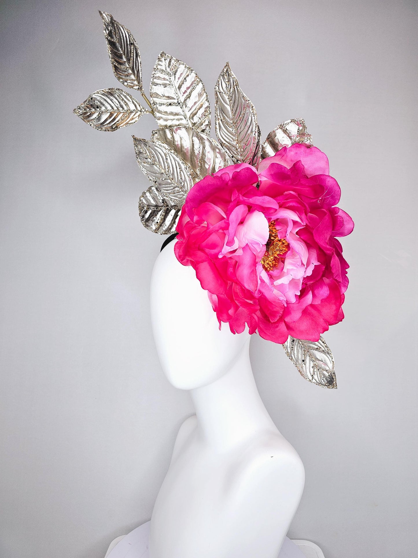 kentucky derby hat fascinator large ombre pink satin silk flower with gold sparkle glitter branching leaves on a black satin headband