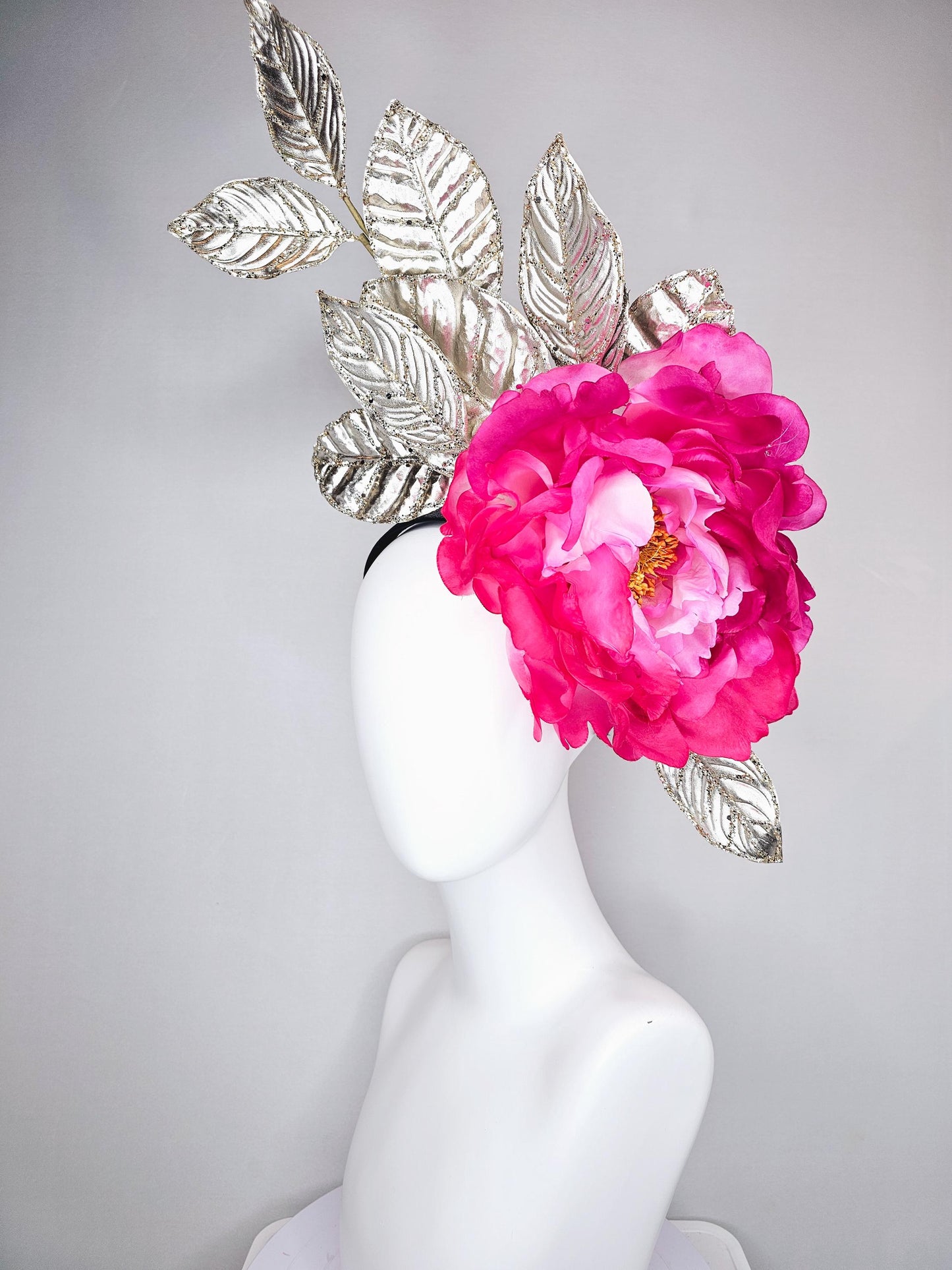 kentucky derby hat fascinator large ombre pink satin silk flower with gold sparkle glitter branching leaves on a black satin headband