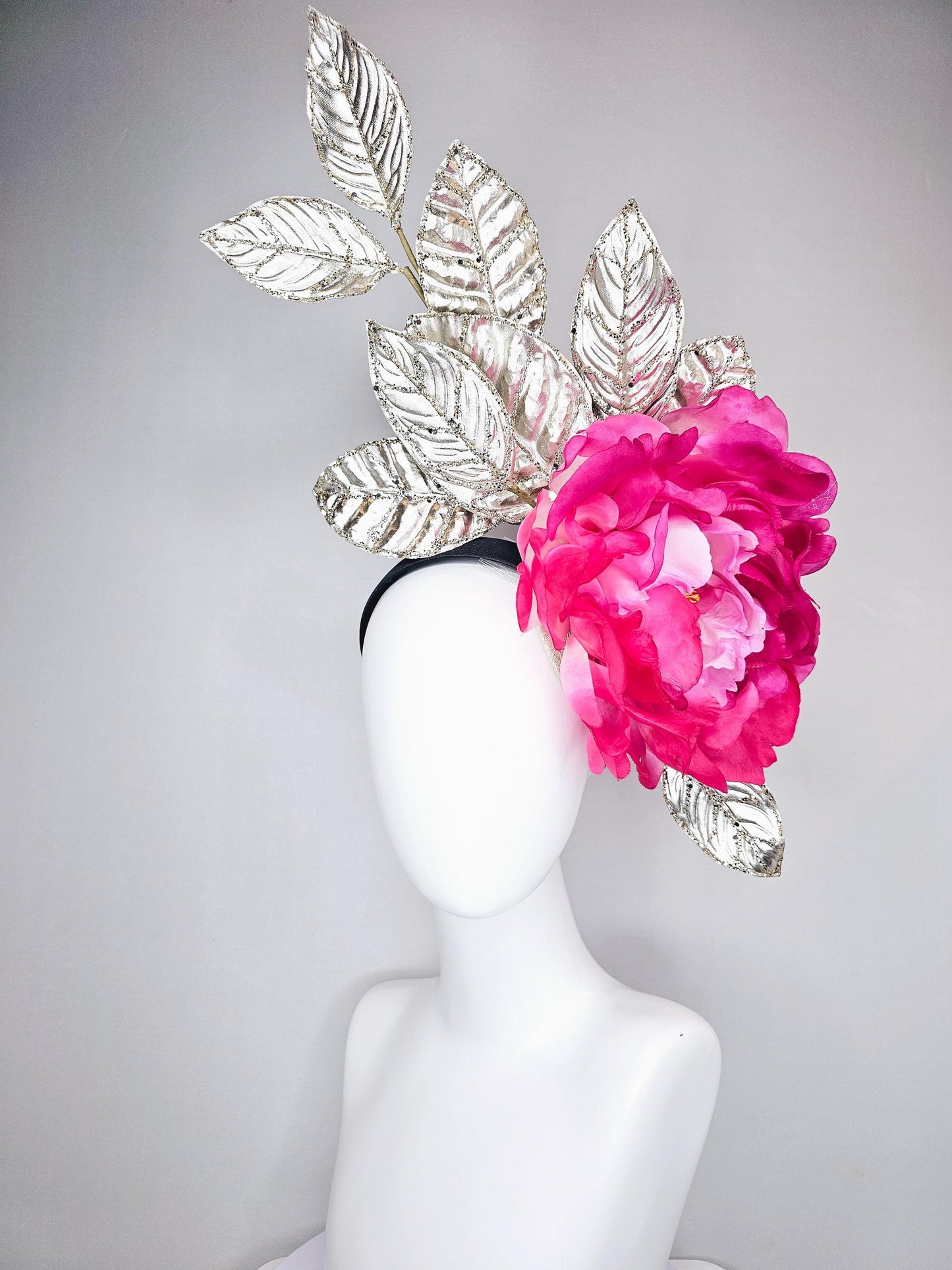 kentucky derby hat fascinator large ombre pink satin silk flower with gold sparkle glitter branching leaves on a black satin headband