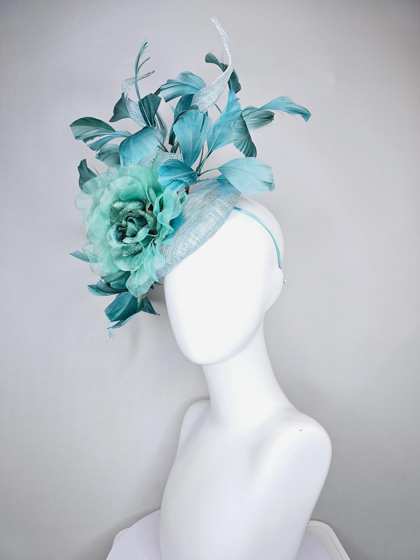 kentucky derby hat fascinator light blue sinamay with mint green large organza satin flower and teal blue branching feathers