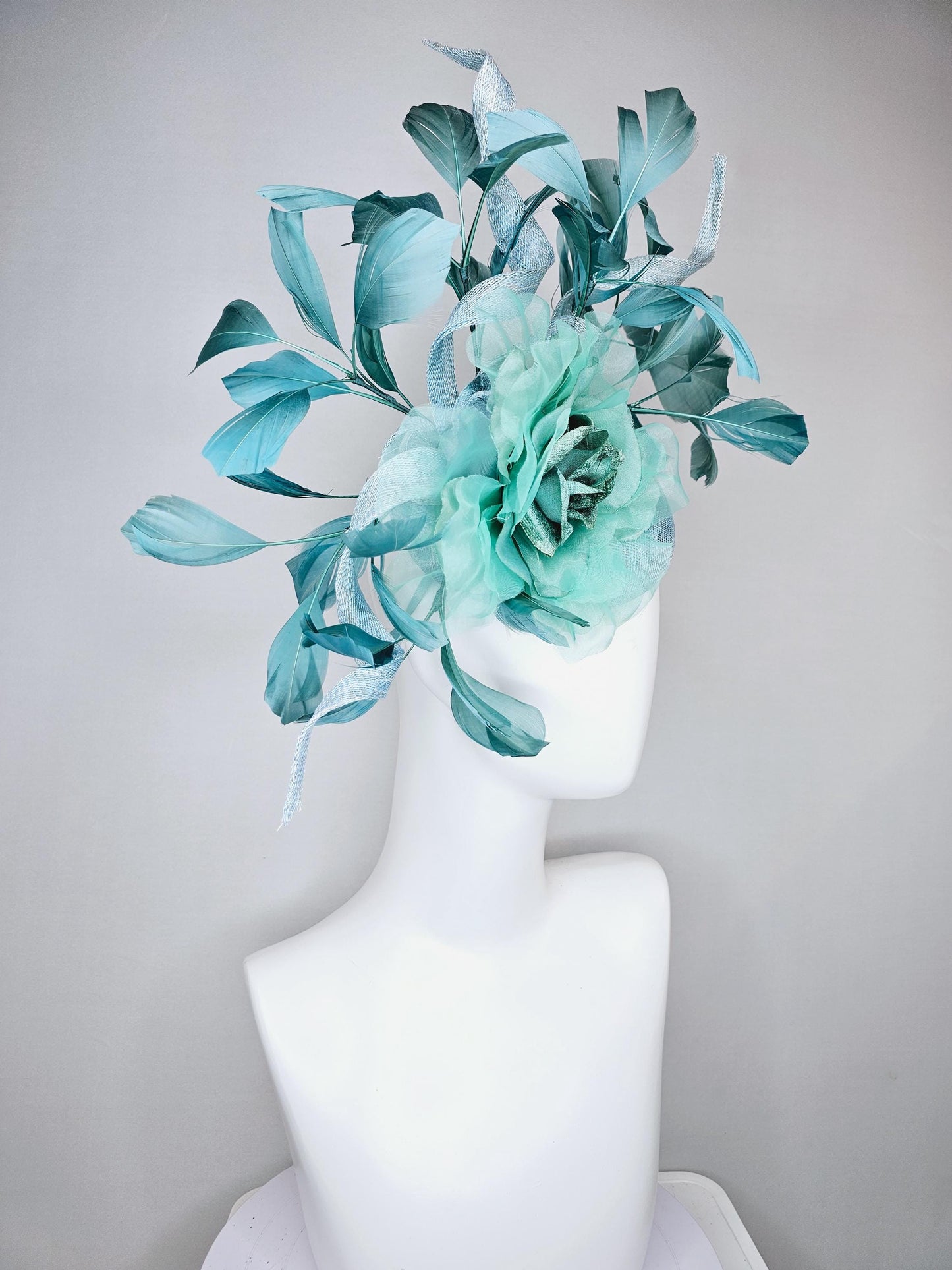 kentucky derby hat fascinator light blue sinamay with mint green large organza satin flower and teal blue branching feathers