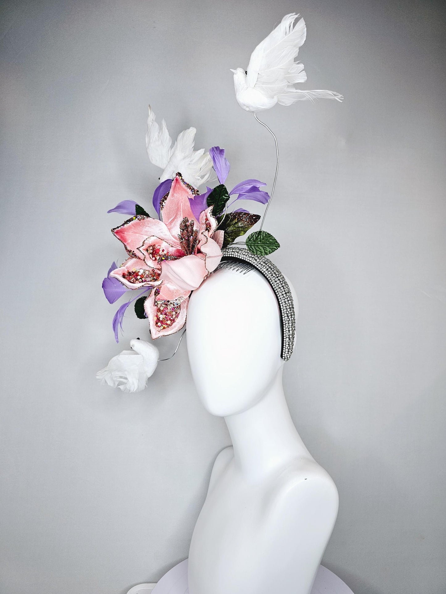 kentucky derby hat fascinator crystal rhinestone headband with light pink sparkle flower, purple lavender feathers and white feather birds