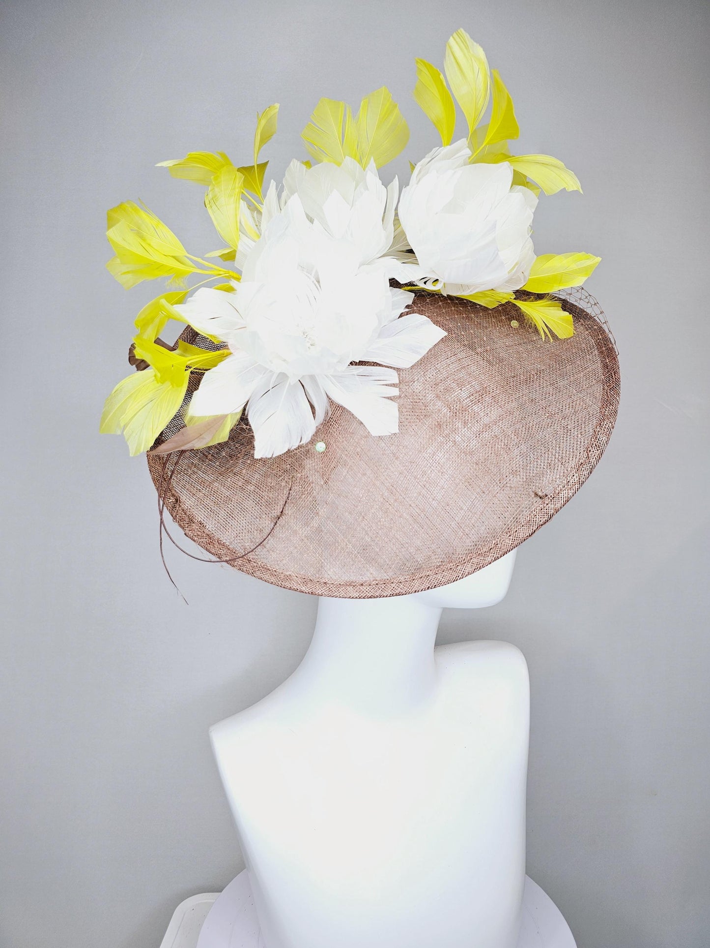 kentucky derby hat fascinator taupe brown sinamay saucer with netting, white fluffy feather flowers and yellow branching feathers