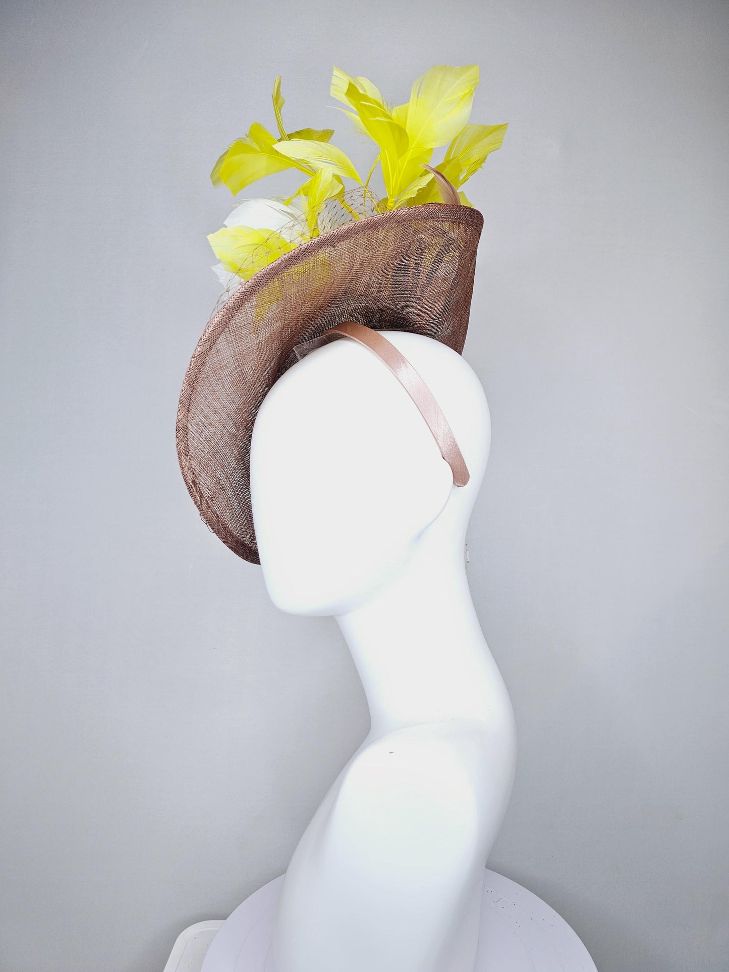 kentucky derby hat fascinator taupe brown sinamay saucer with netting, white fluffy feather flowers and yellow branching feathers